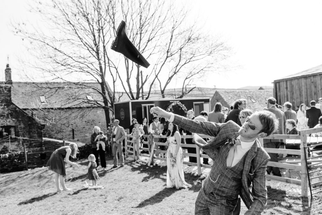 Groom throwing a welly
