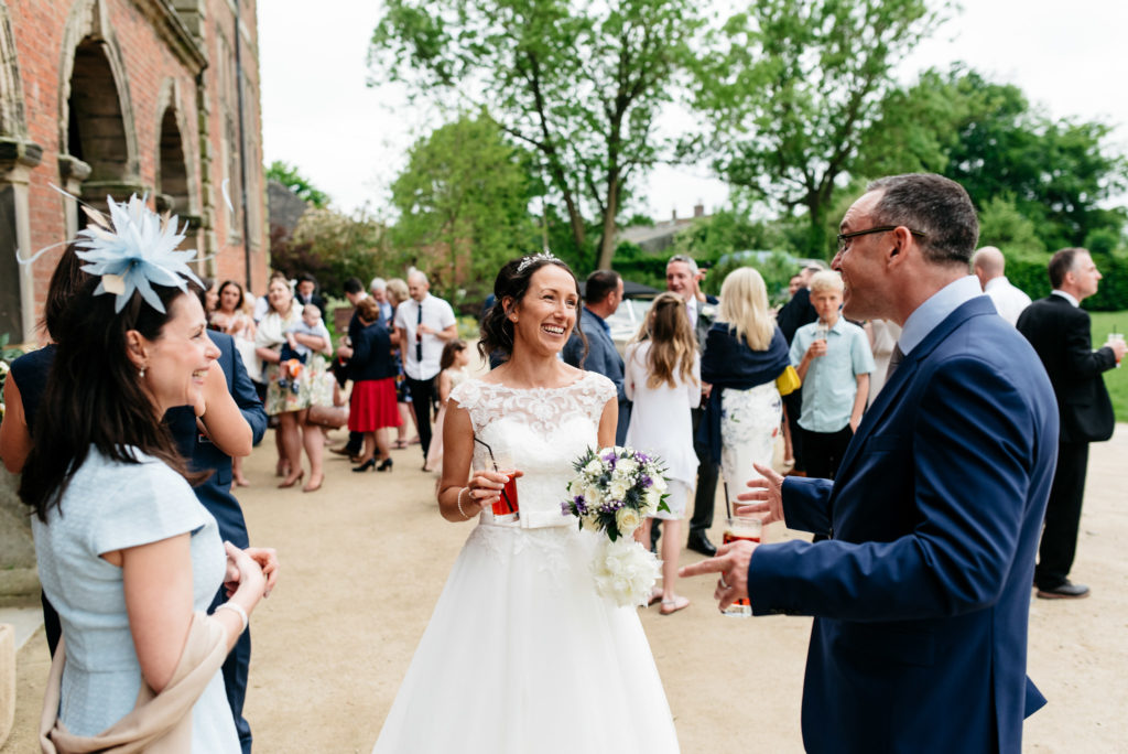 bride chatting with guests