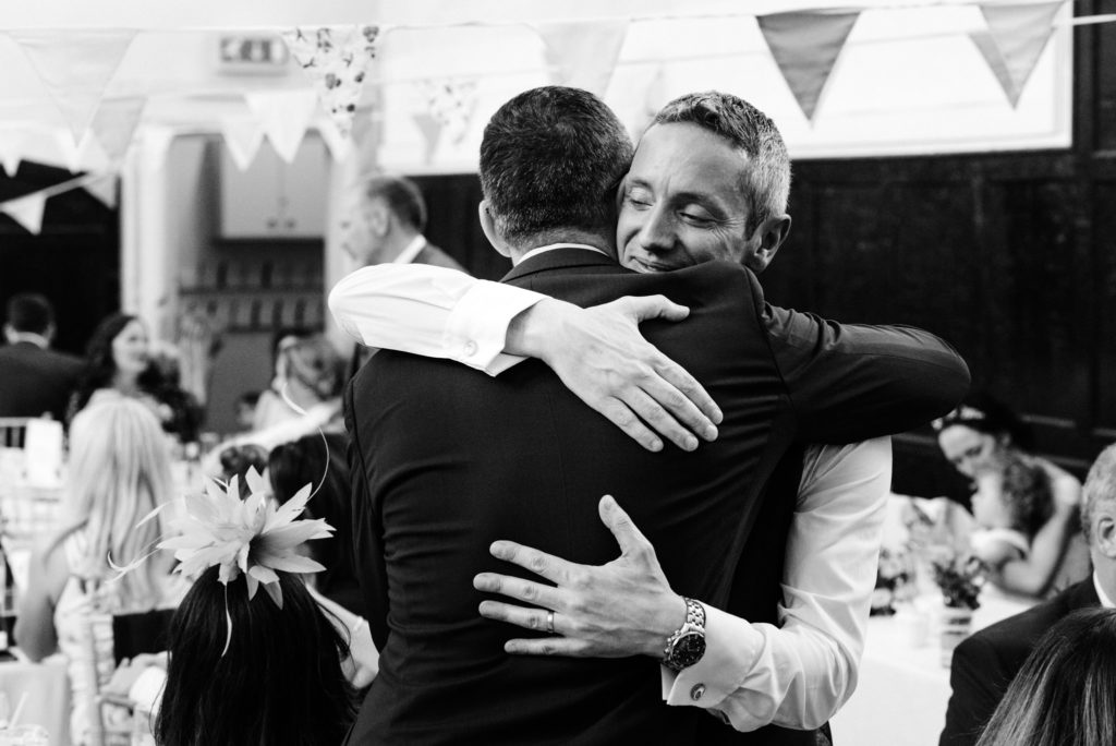 hugging the groom