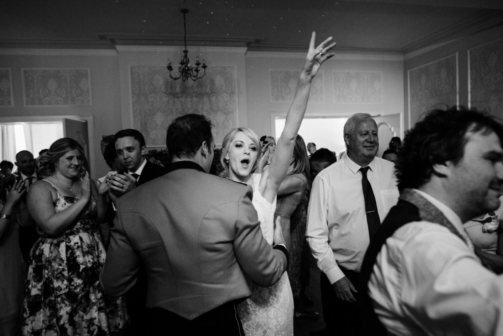 bride cheering on the dance floor