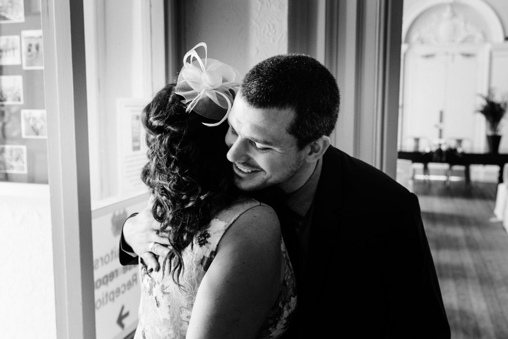 groom greeting guests