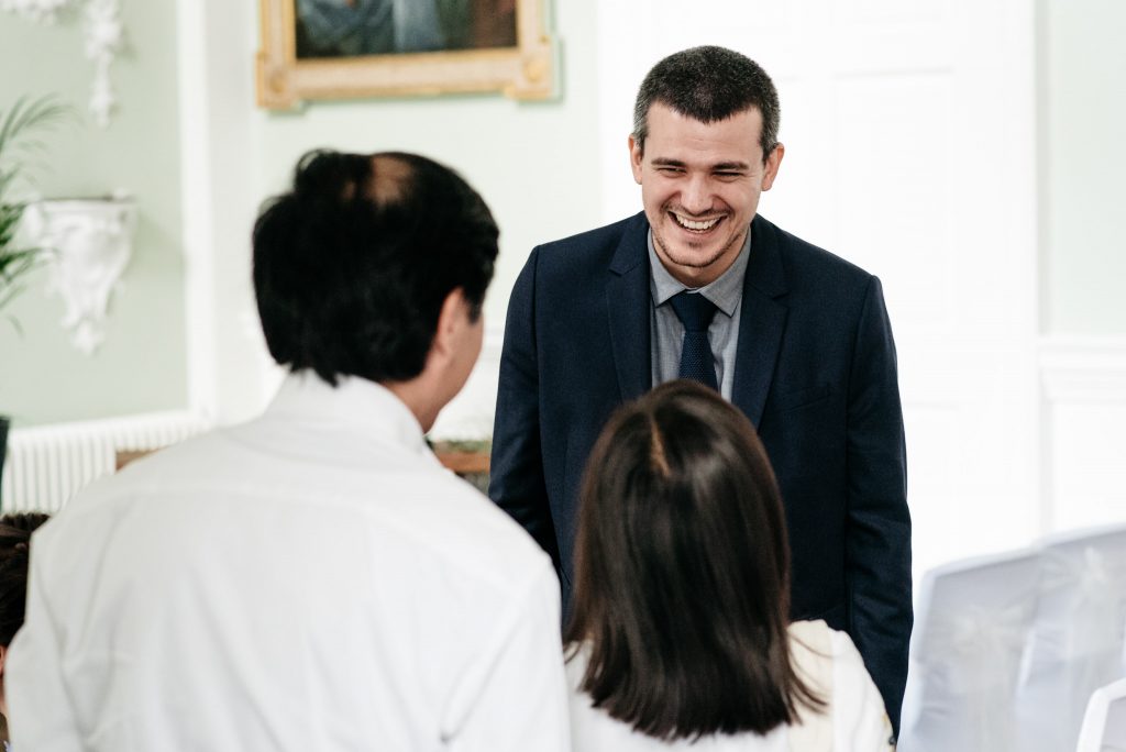 laughing groom