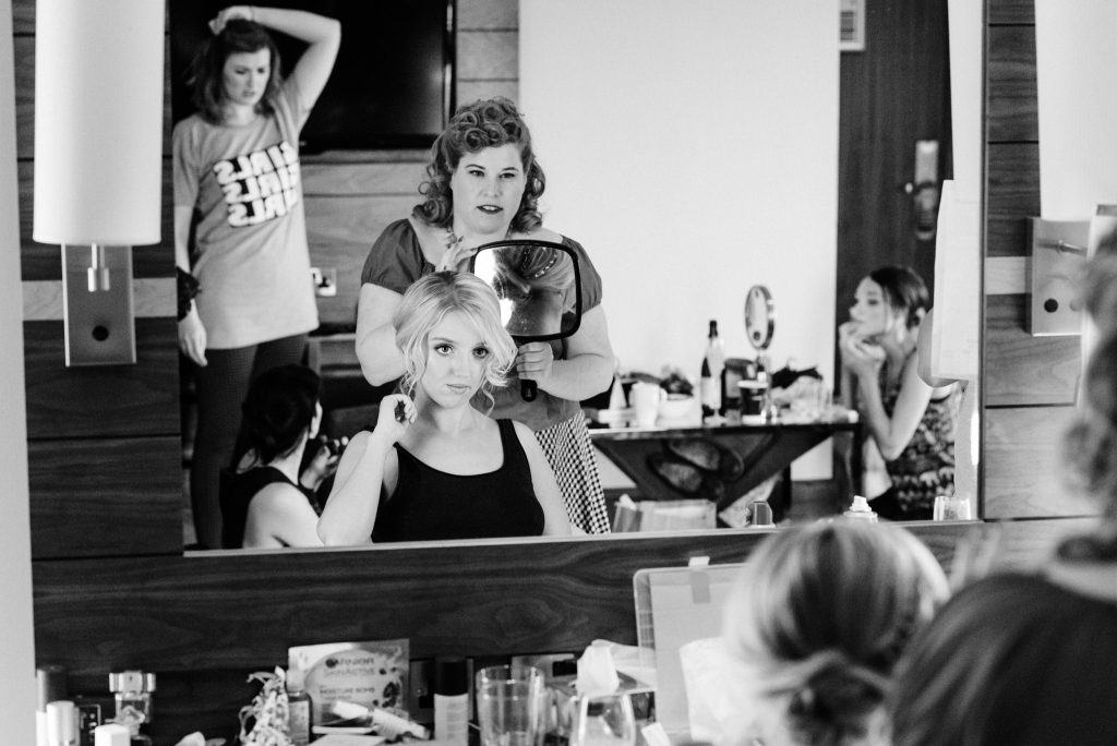 blonde bridesmaid looking in the mirror