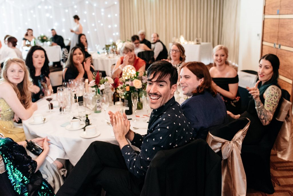 excited guests at wedding table