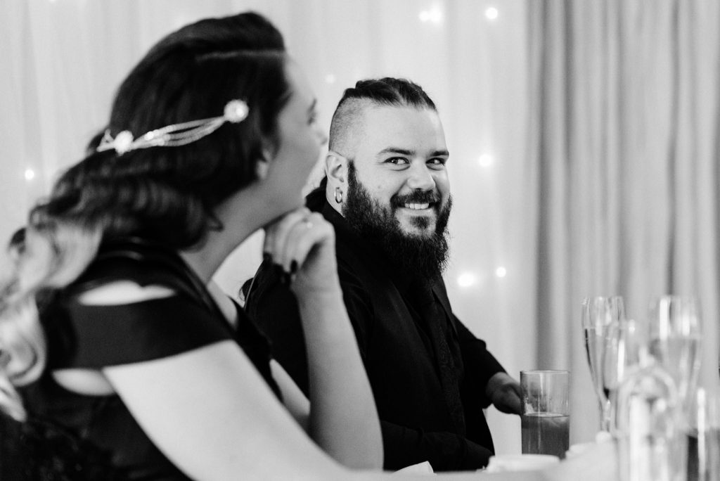 groom looks lovingly at his new wife