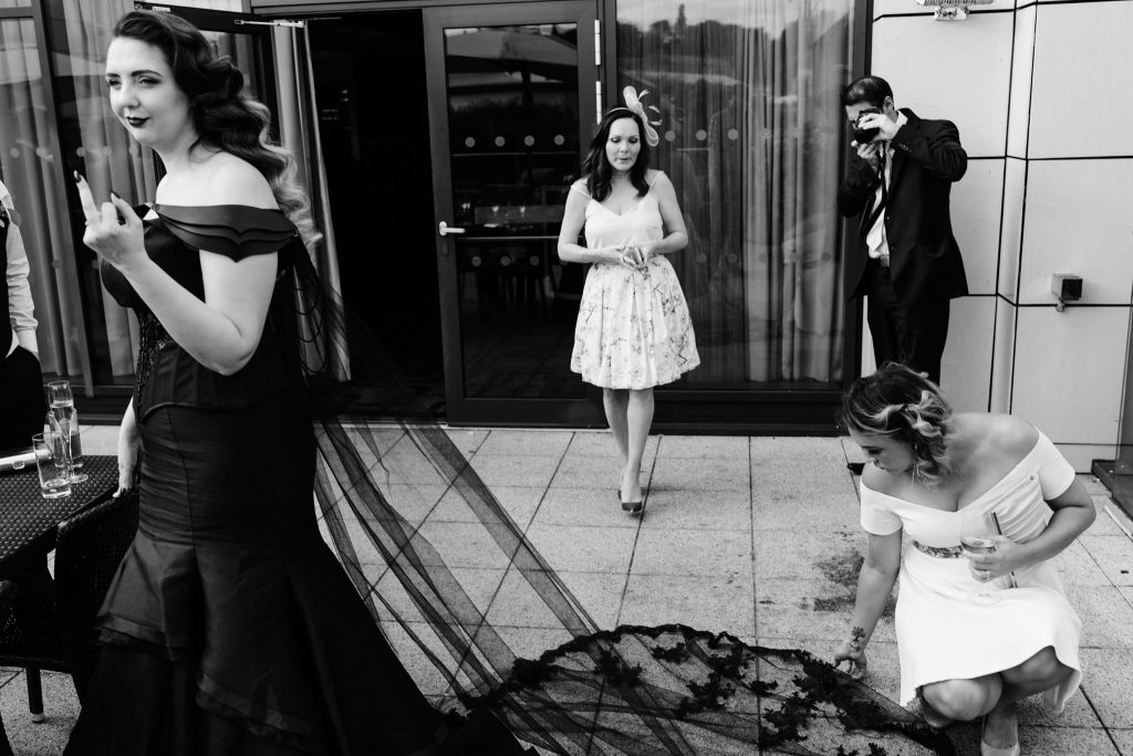 funny photo of bride giving someone the middle finger