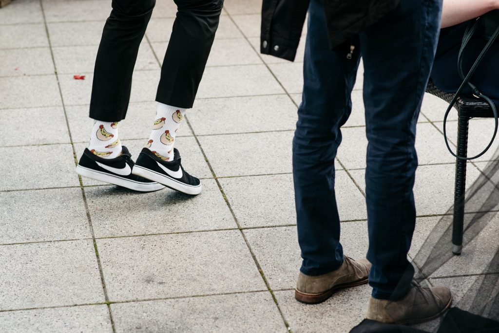 showing off fancy socks at a wedding