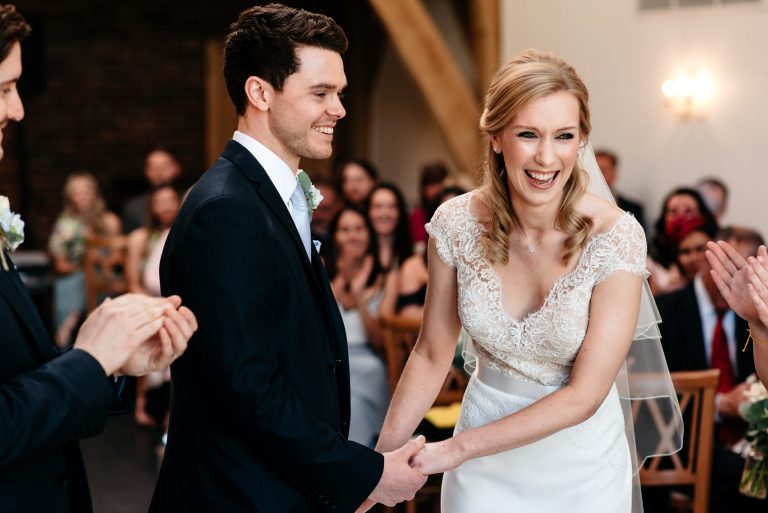 smiling laughing couple getting married