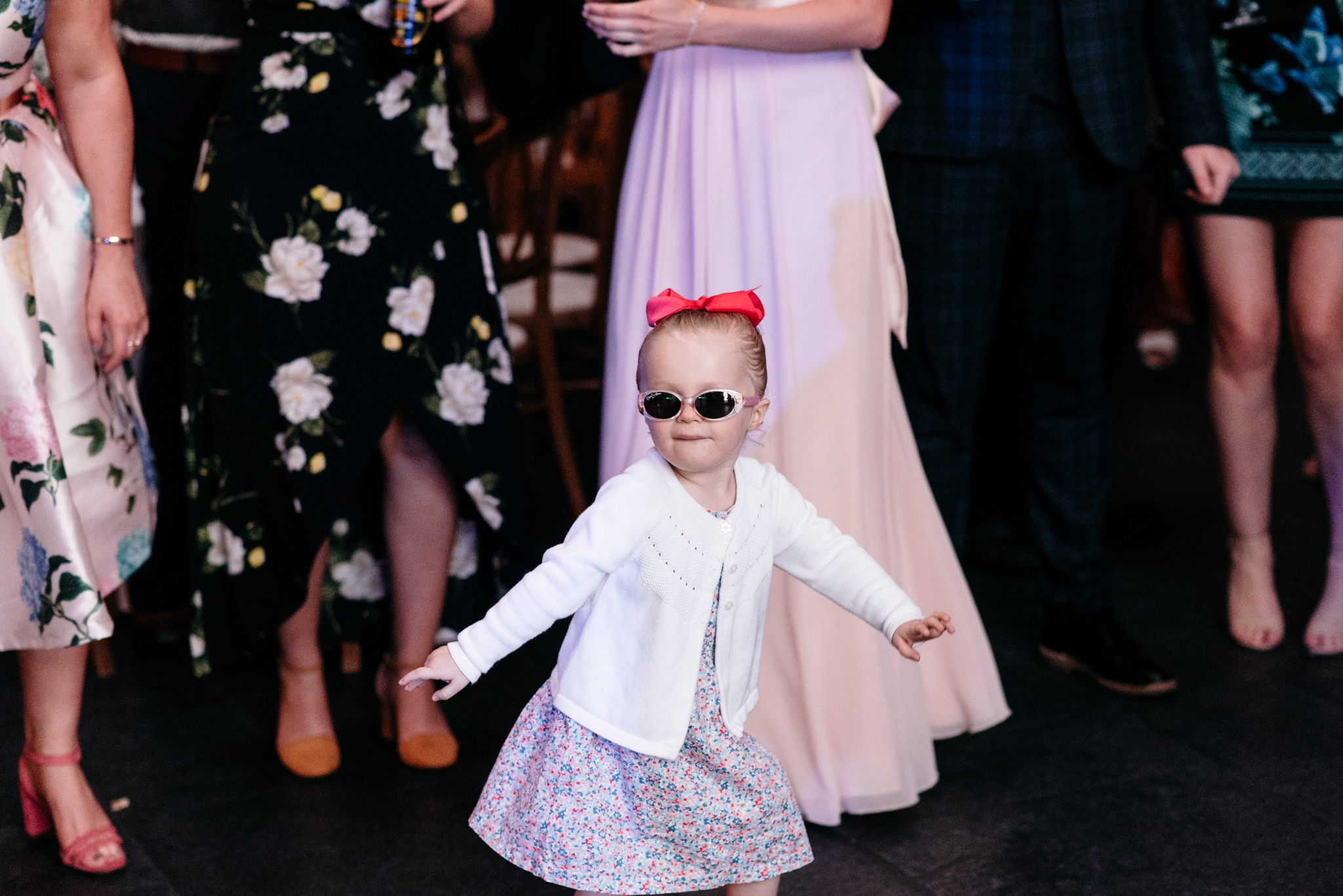 little girl dancing in shades at a leicestershire wedding venue
