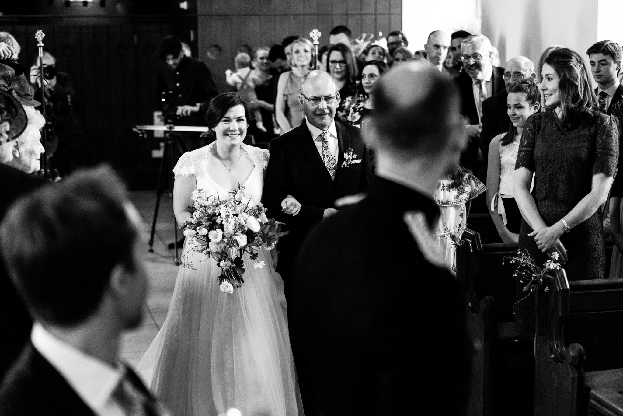 bride walking down the aisle with her father at holme pierrepont in nottingham