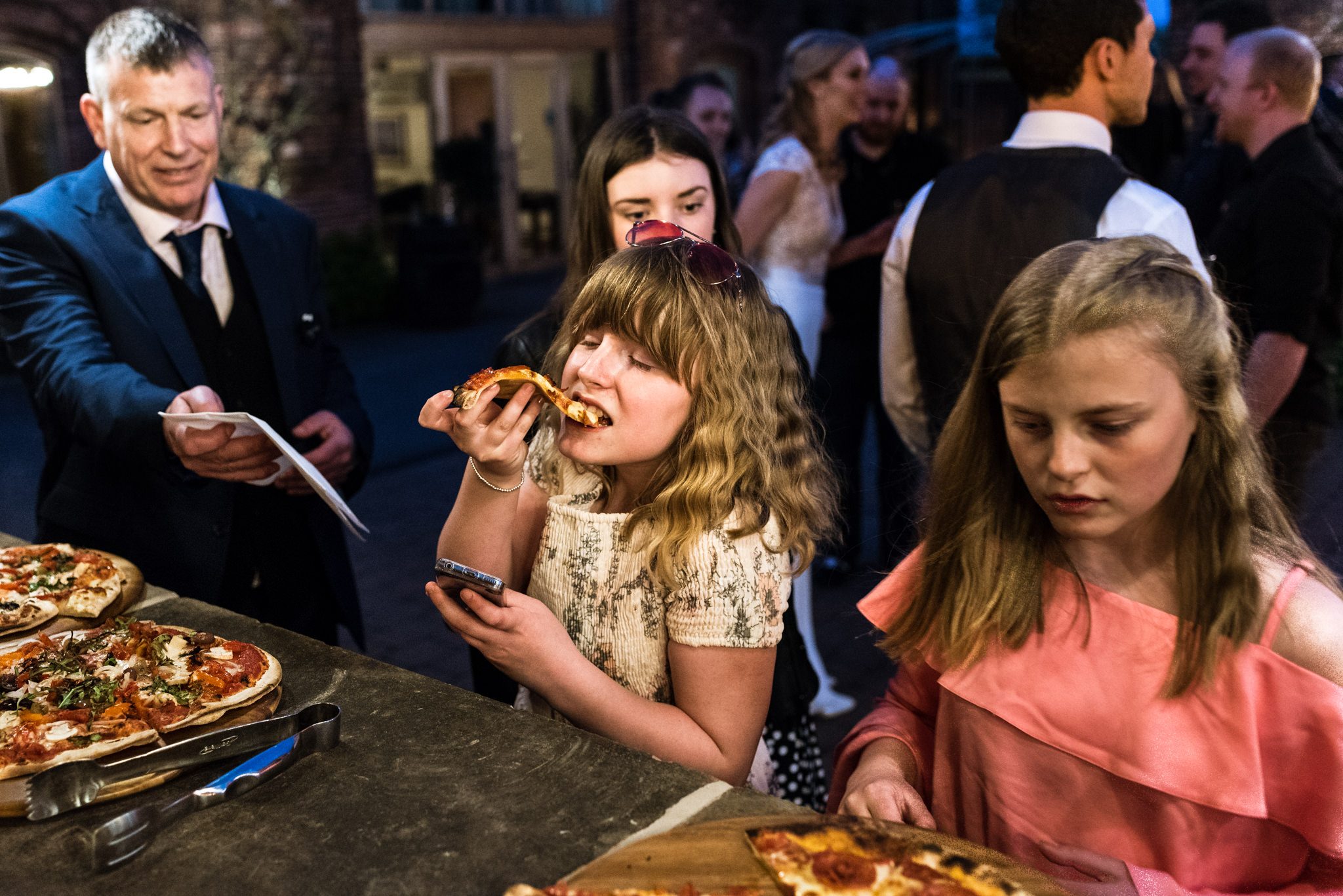 little girl enjoying a slice of pizza