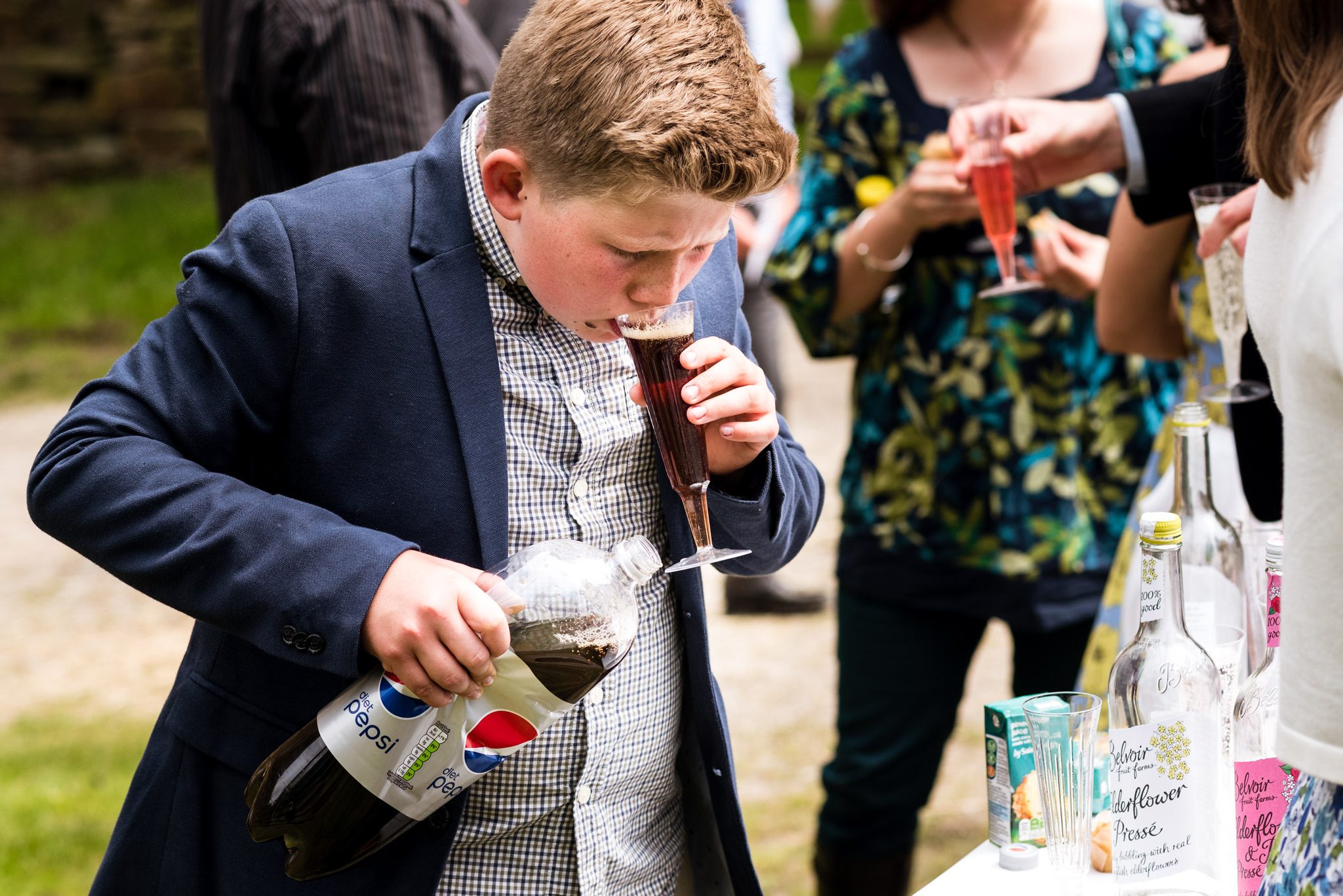 boy drinking from bottle of coke