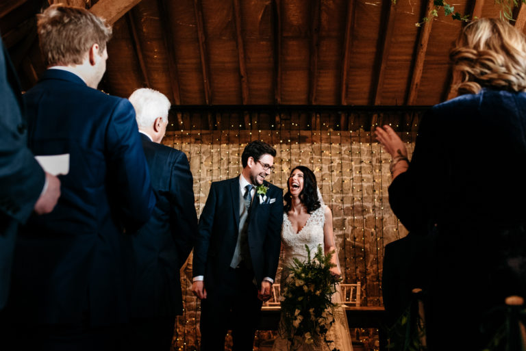 happy laughing couple at grittenham barn