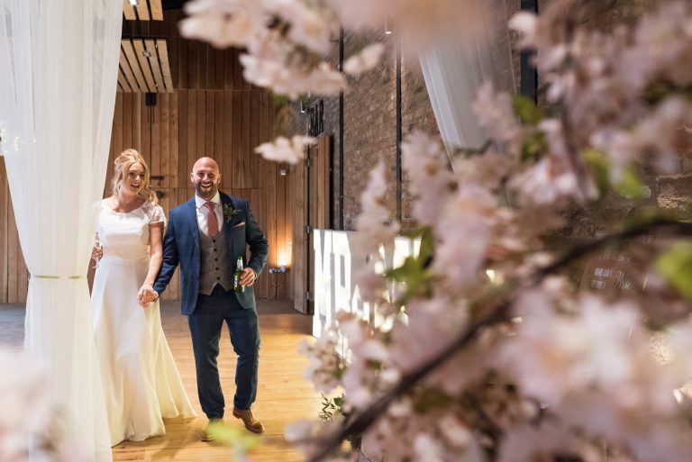 newlyweds entrance into their reception at norton fields