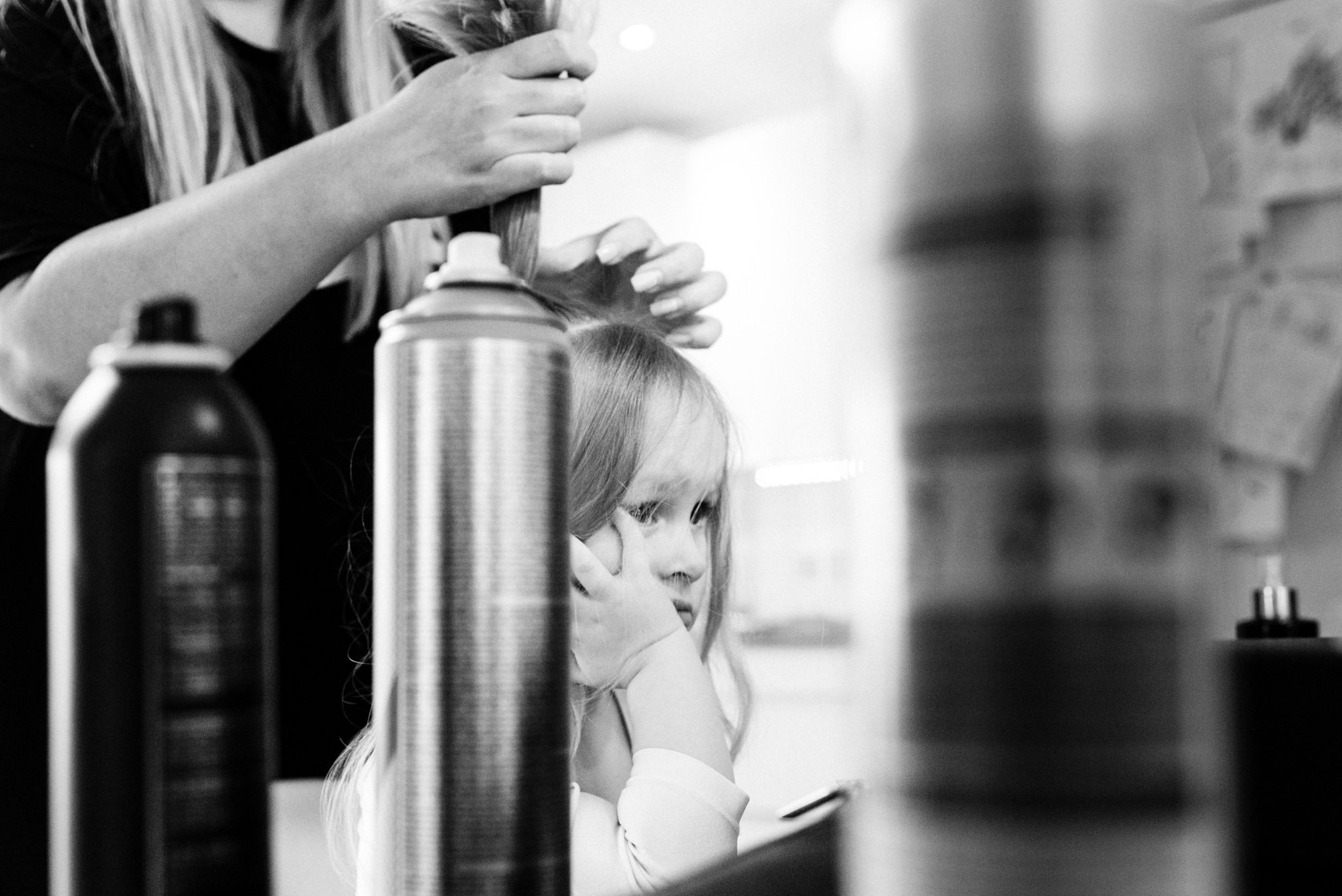 little girl bored having hair done