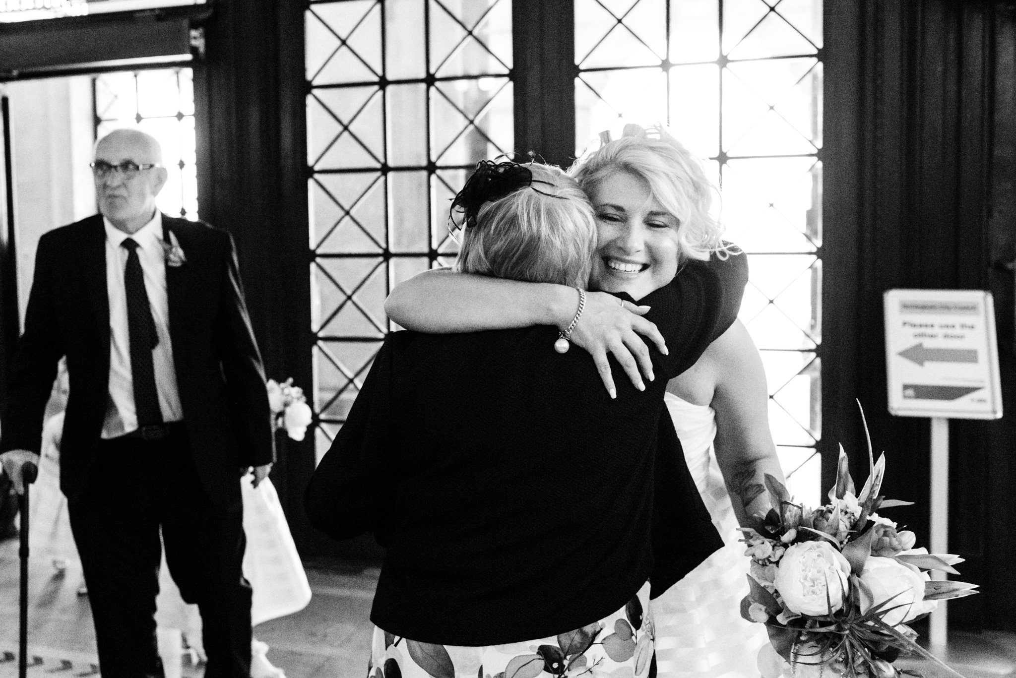 bride hugging guests