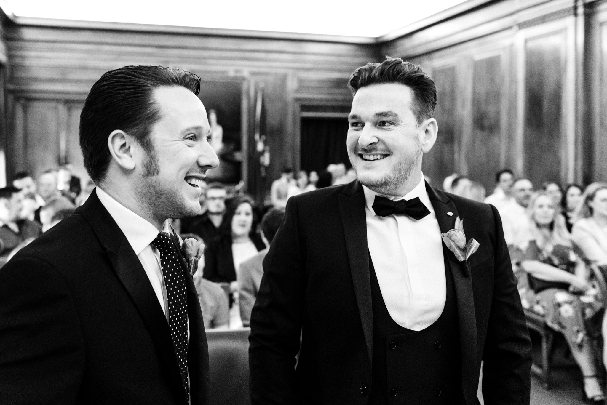 groom laughing with best man