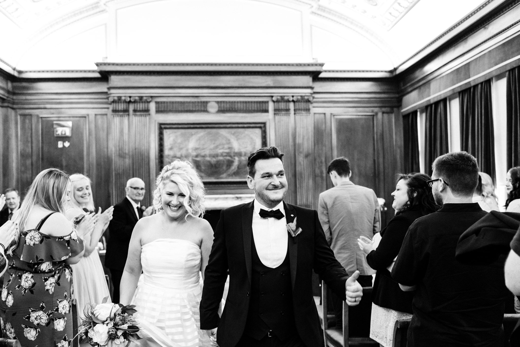 bride and groom walking down the aisle together
