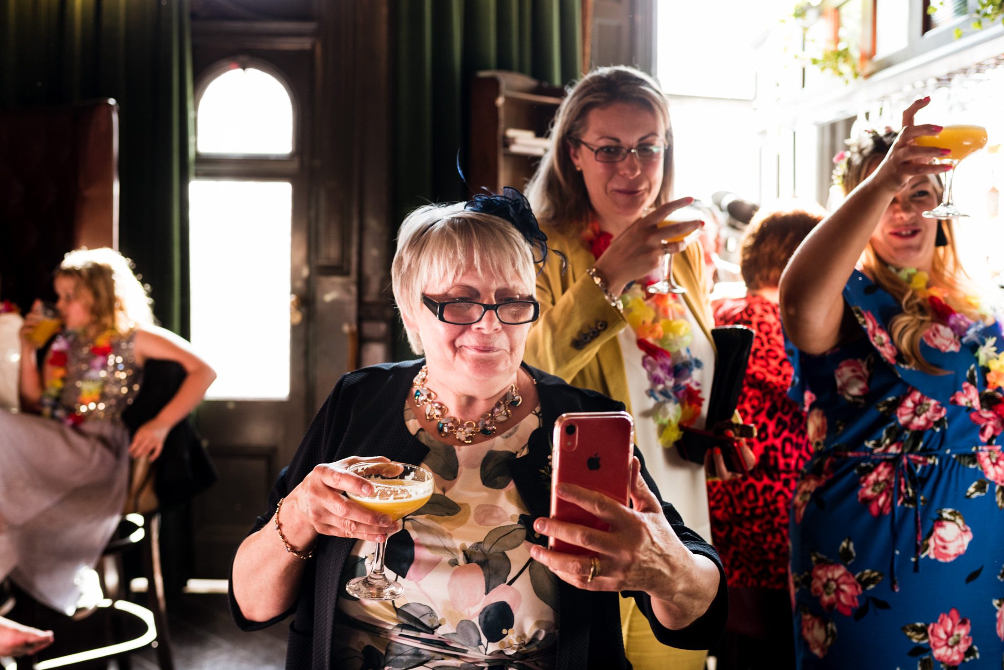 mother of the bride taking a photo