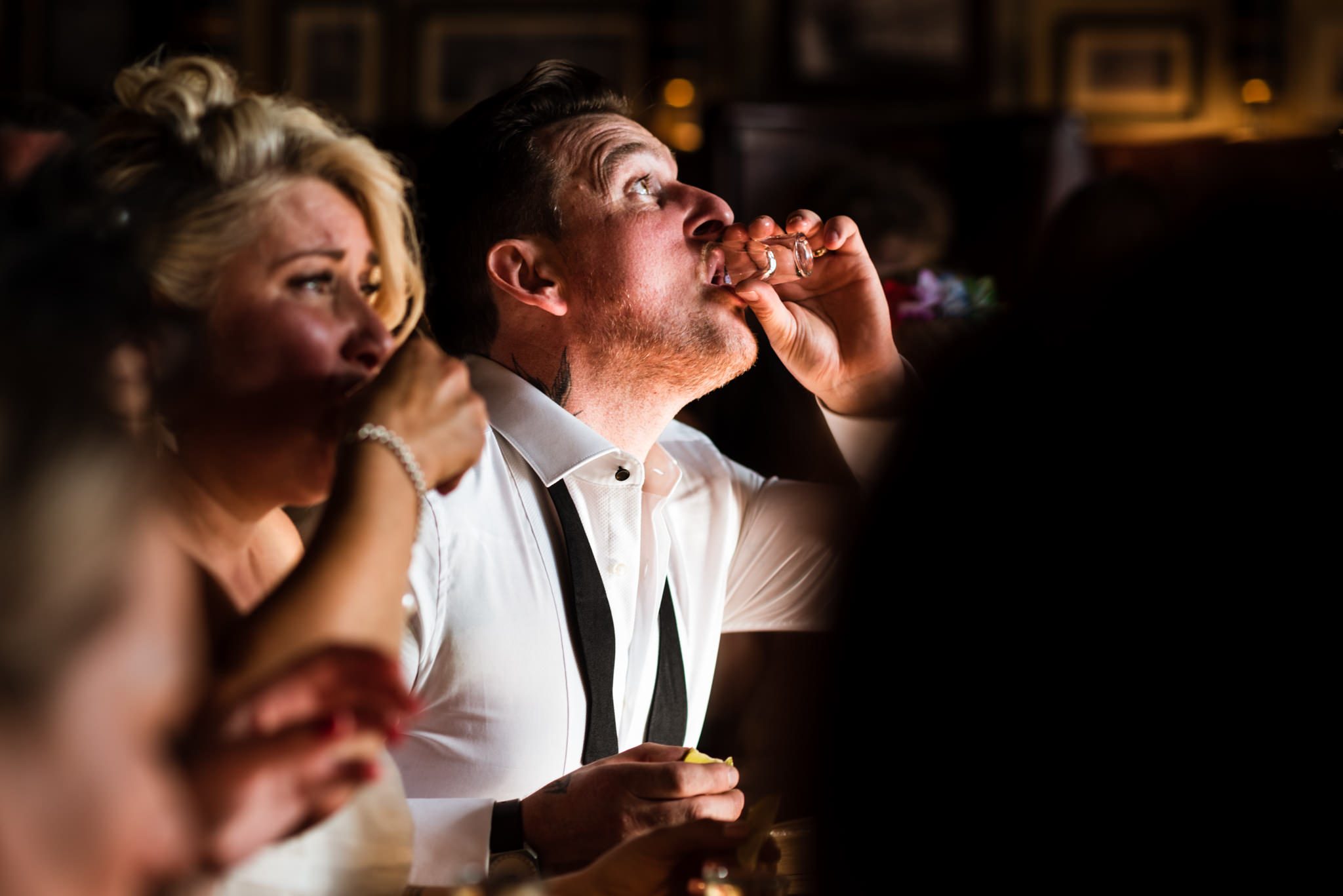 groom doing tequila slammers