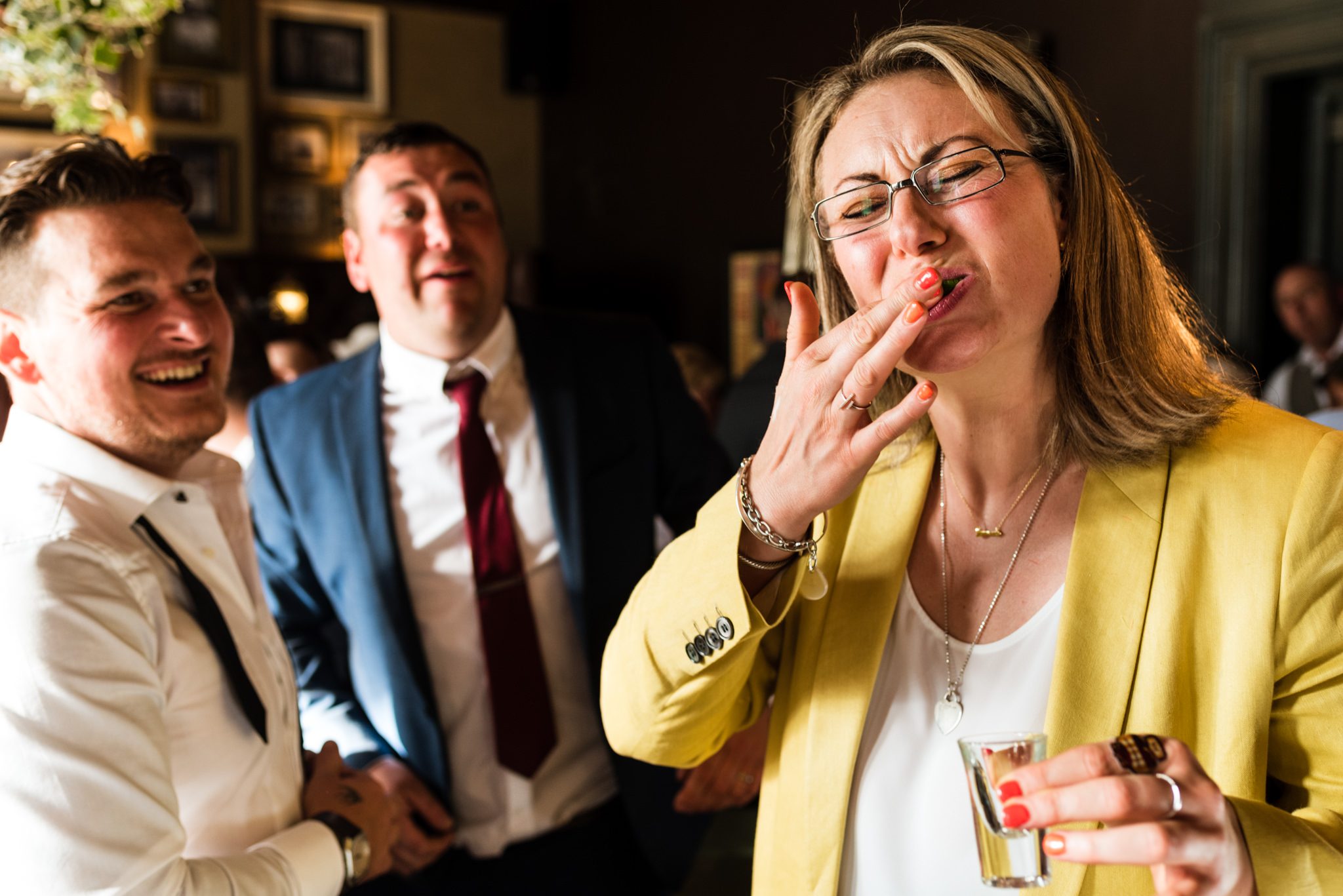 guest sucking a lime after tequila slammer