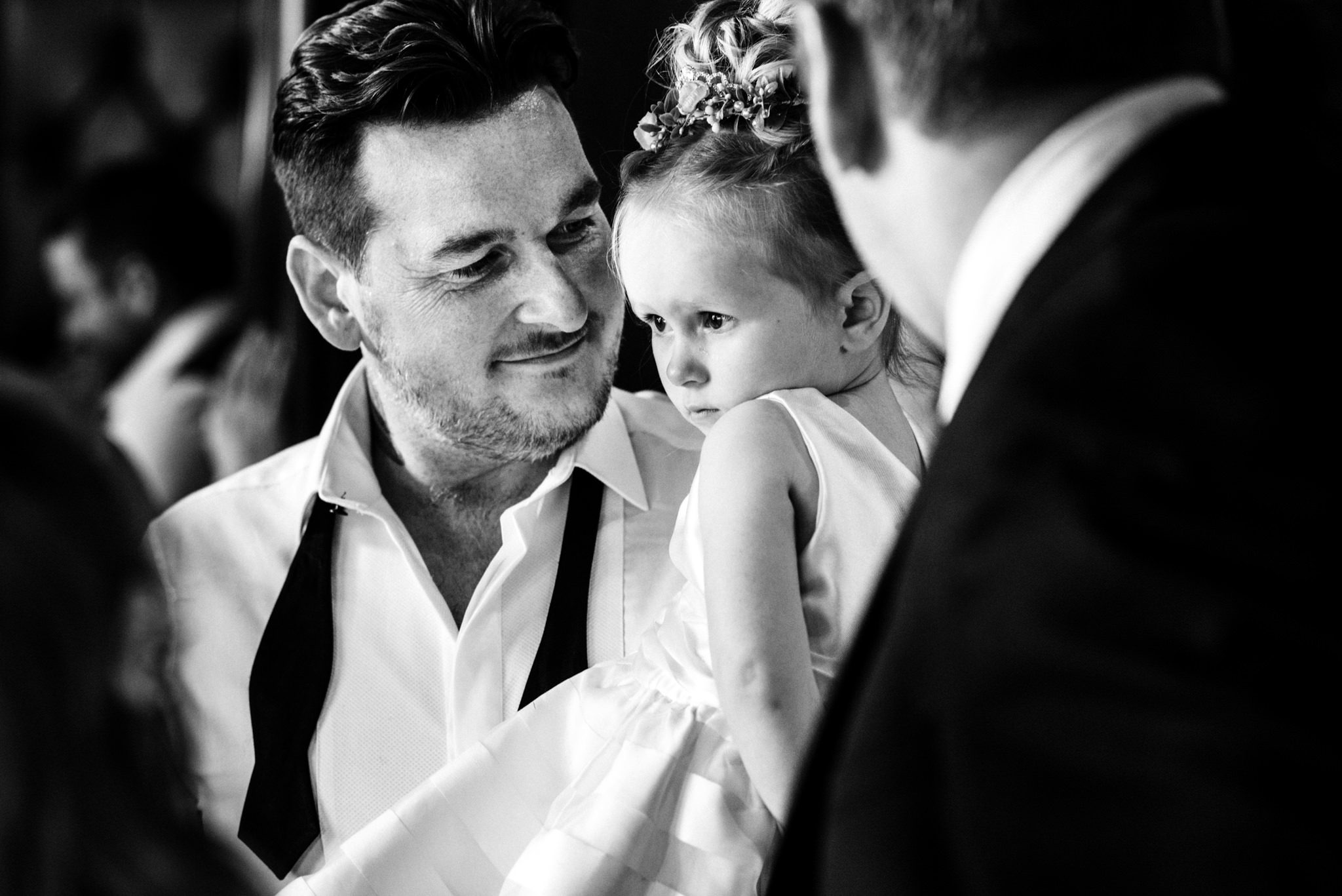 groom holding his daughter
