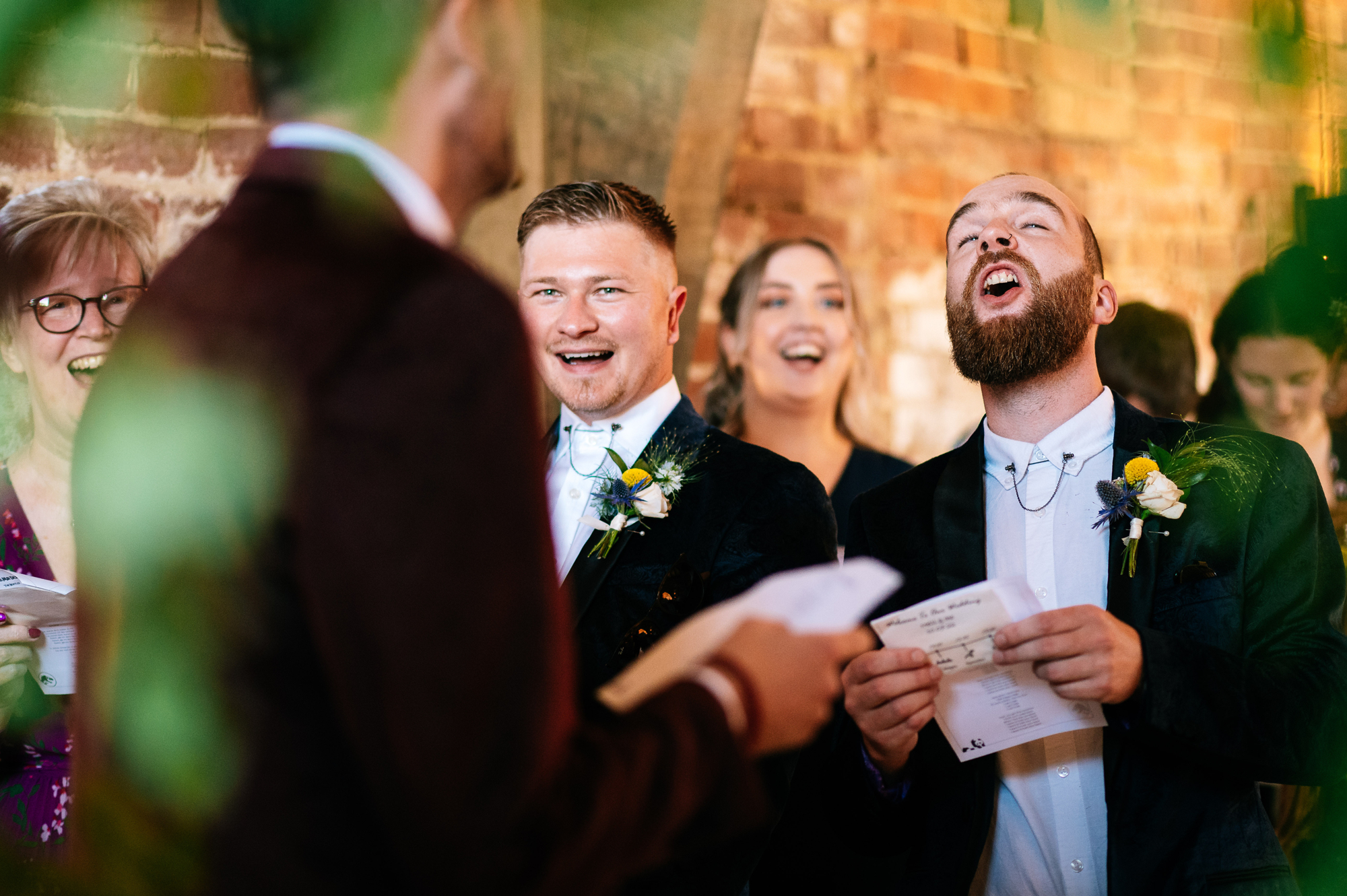 groomsmen funny singing during the ceremony