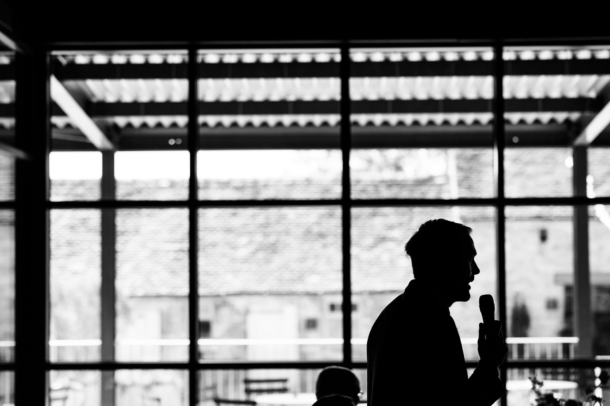 silhouette of groom giving a speech