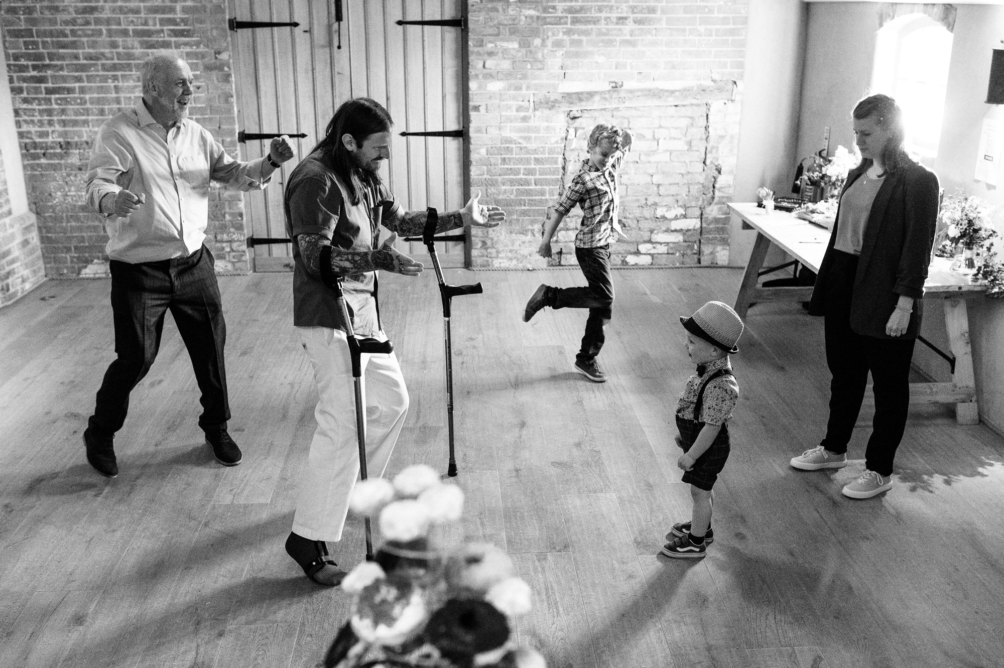 adults and kids dancing on the dancefloor