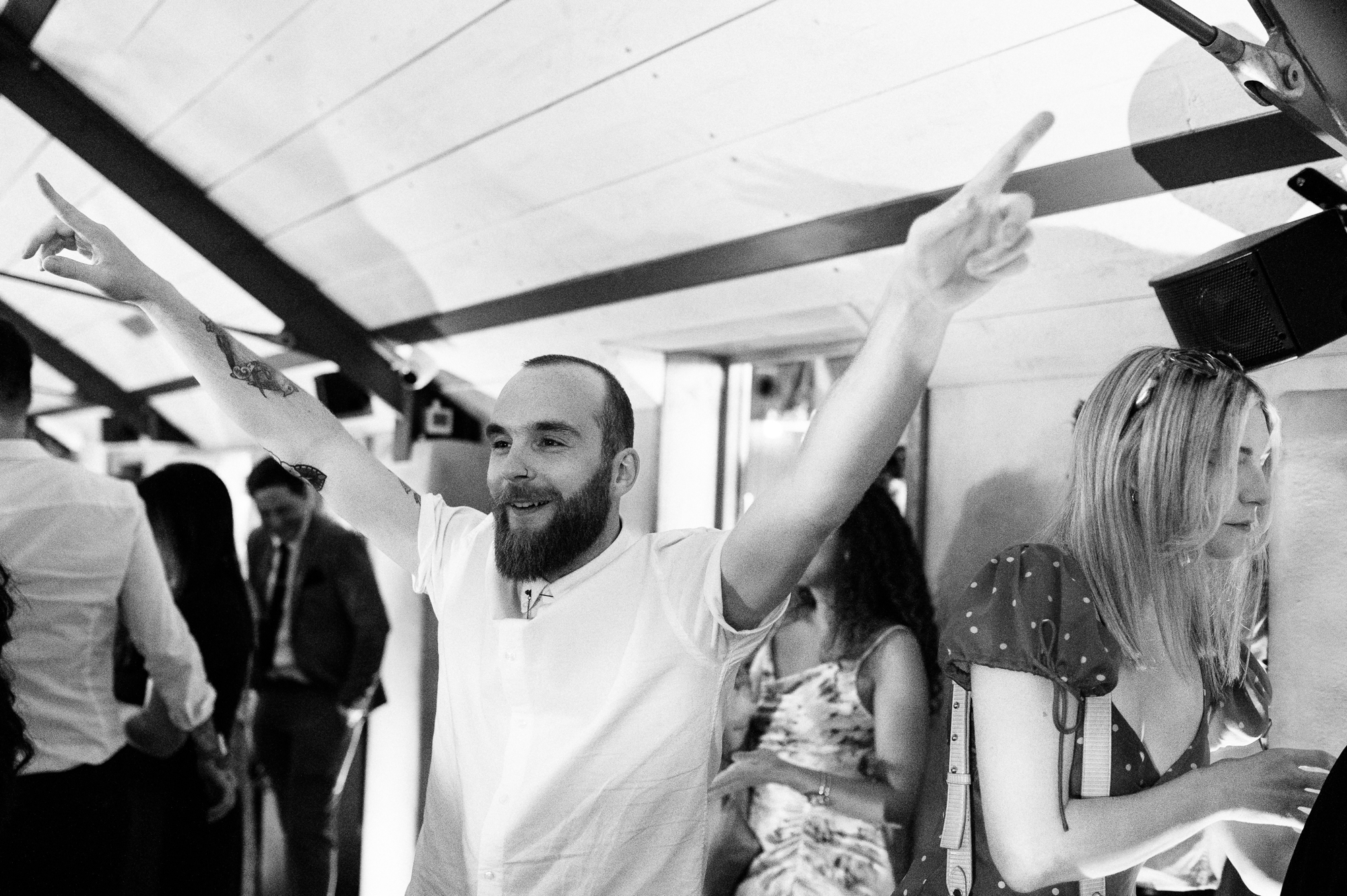 best man throwing his hands in the air