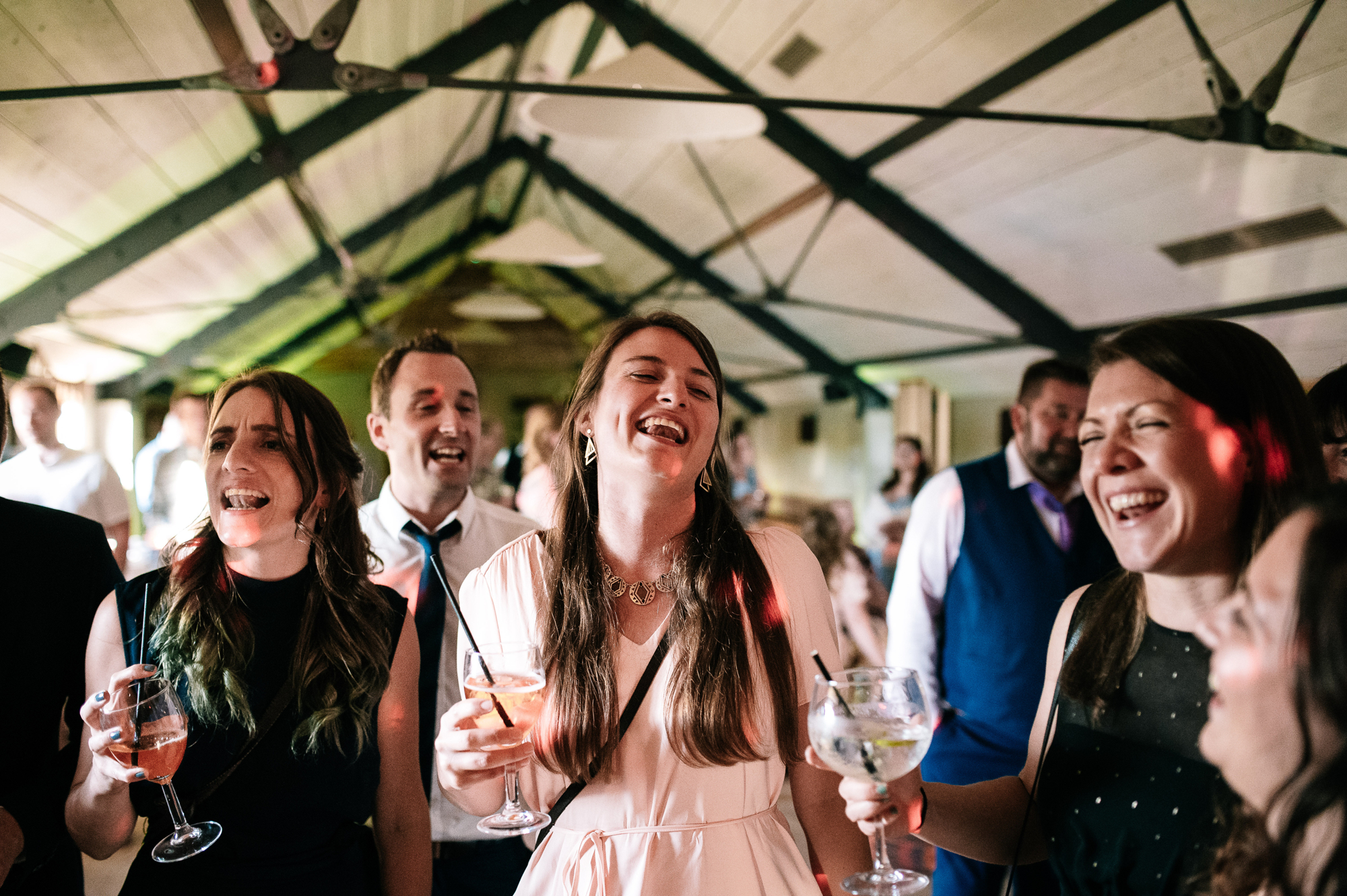 women singing along on the dancefloor