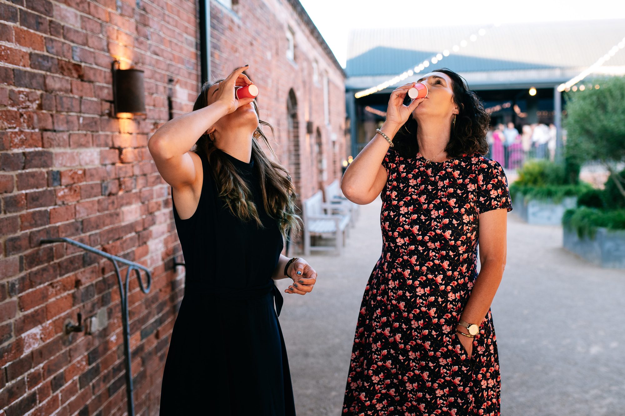 women drinking shots