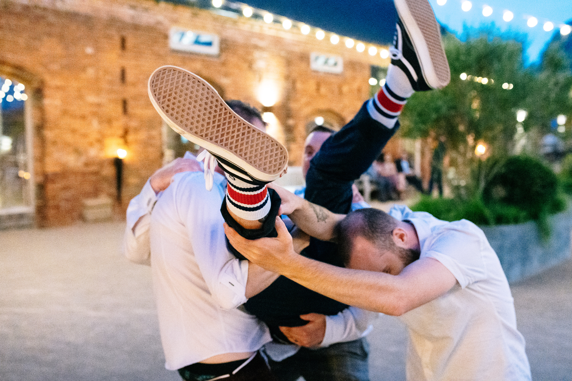 groomsmen wearing vans and tube socks being picked up