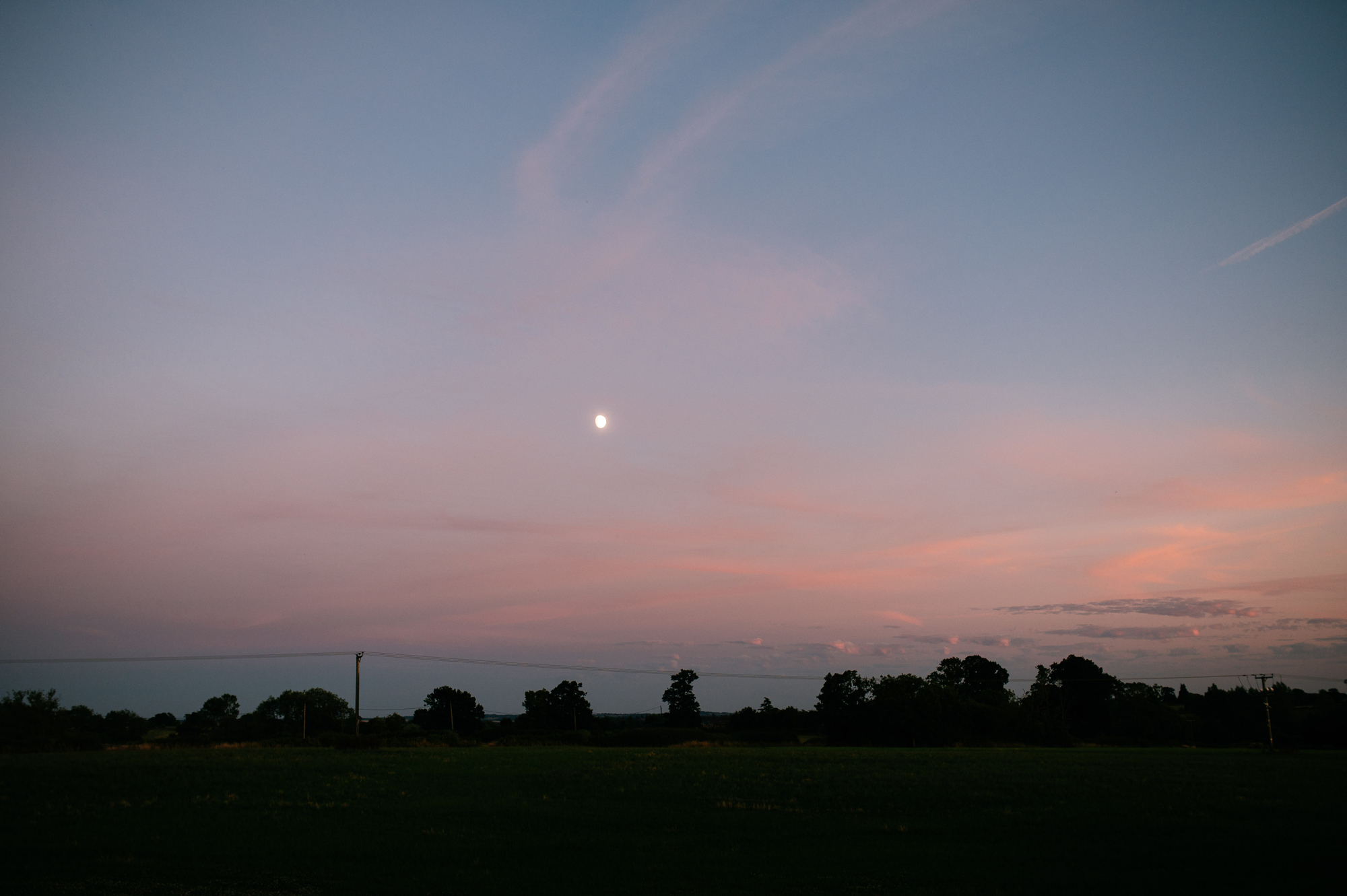 moon in the sky over the derbyshire countryside