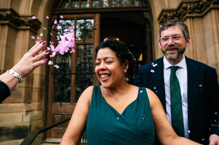close up confetti toss in brides face
