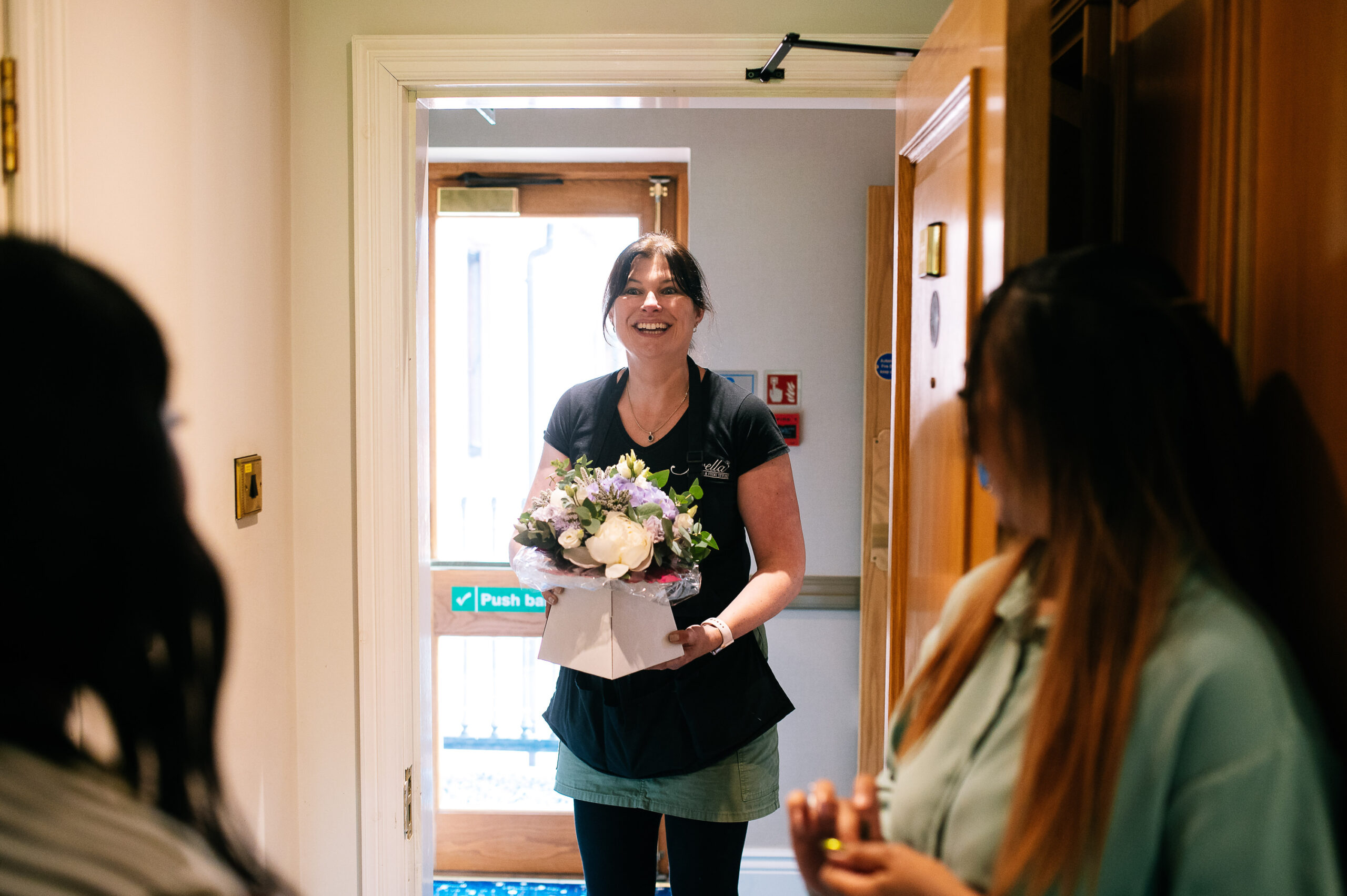 florist delivering flowers to hotel room