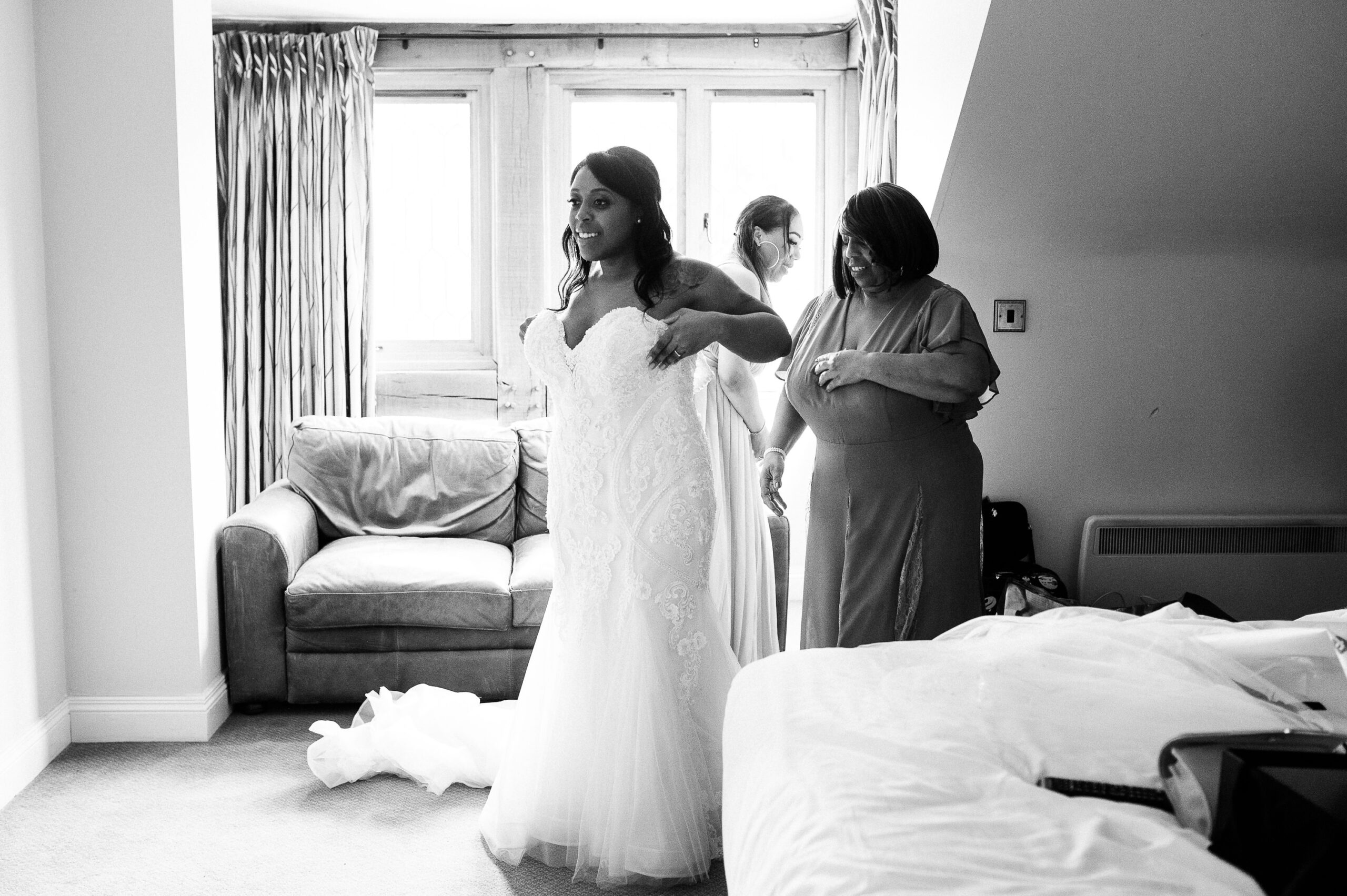 bride getting into her wedding dress