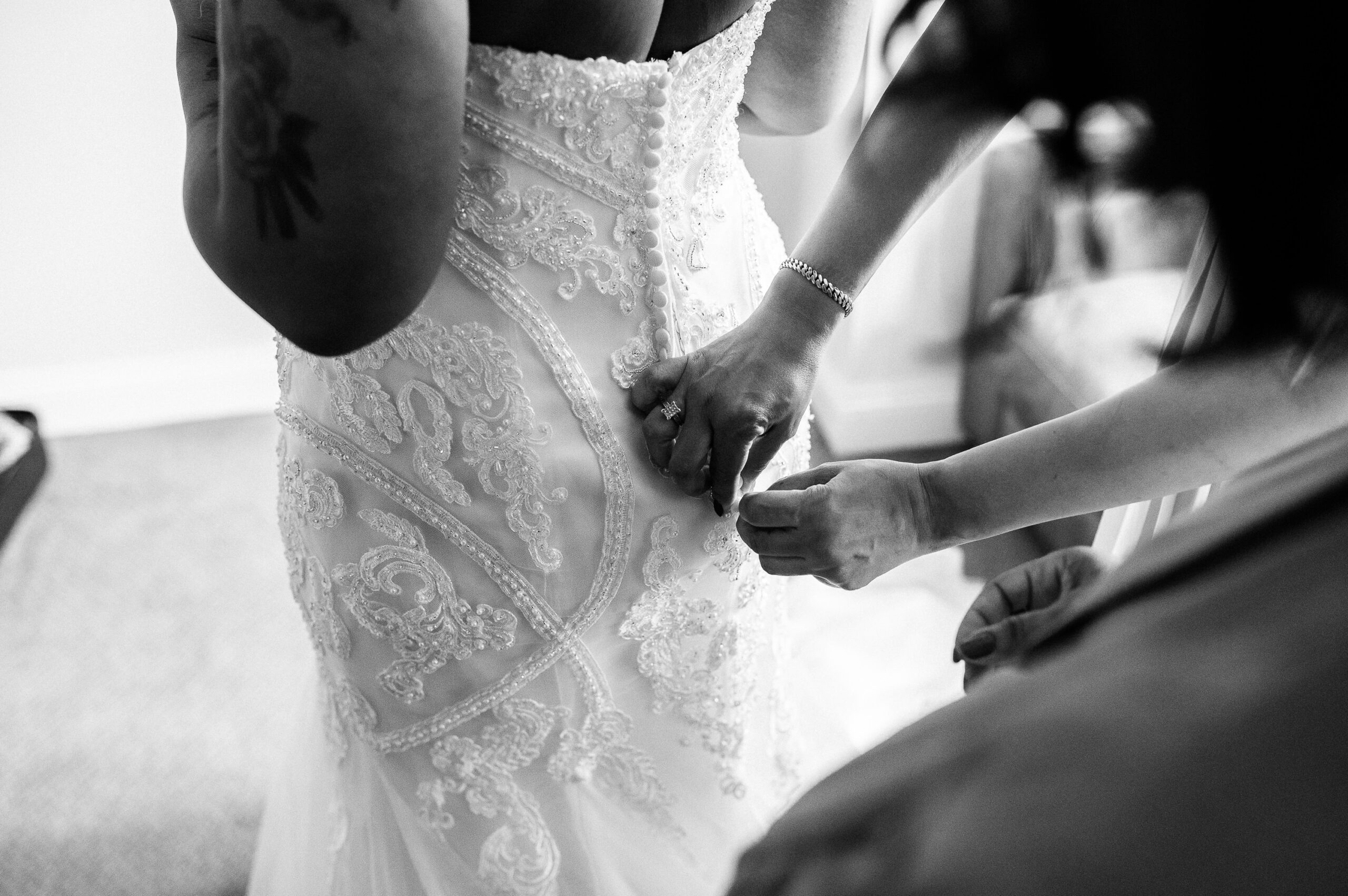 closeup of the back of the dress being zipped up