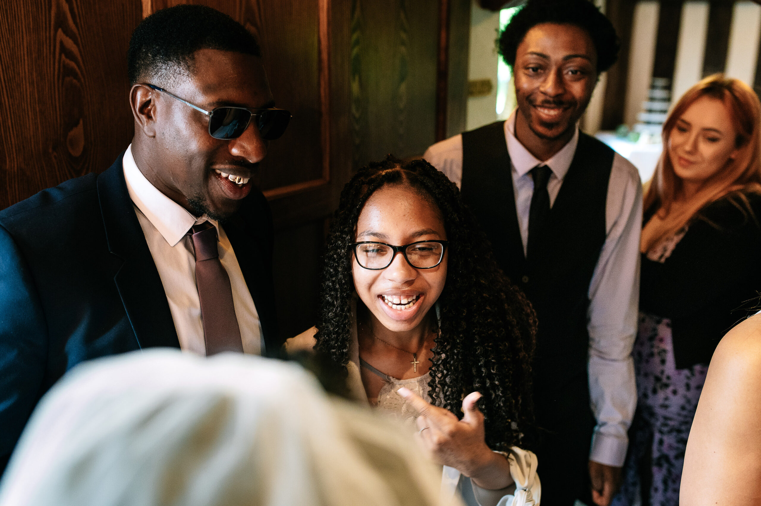 smiling happy family congratulating the couple