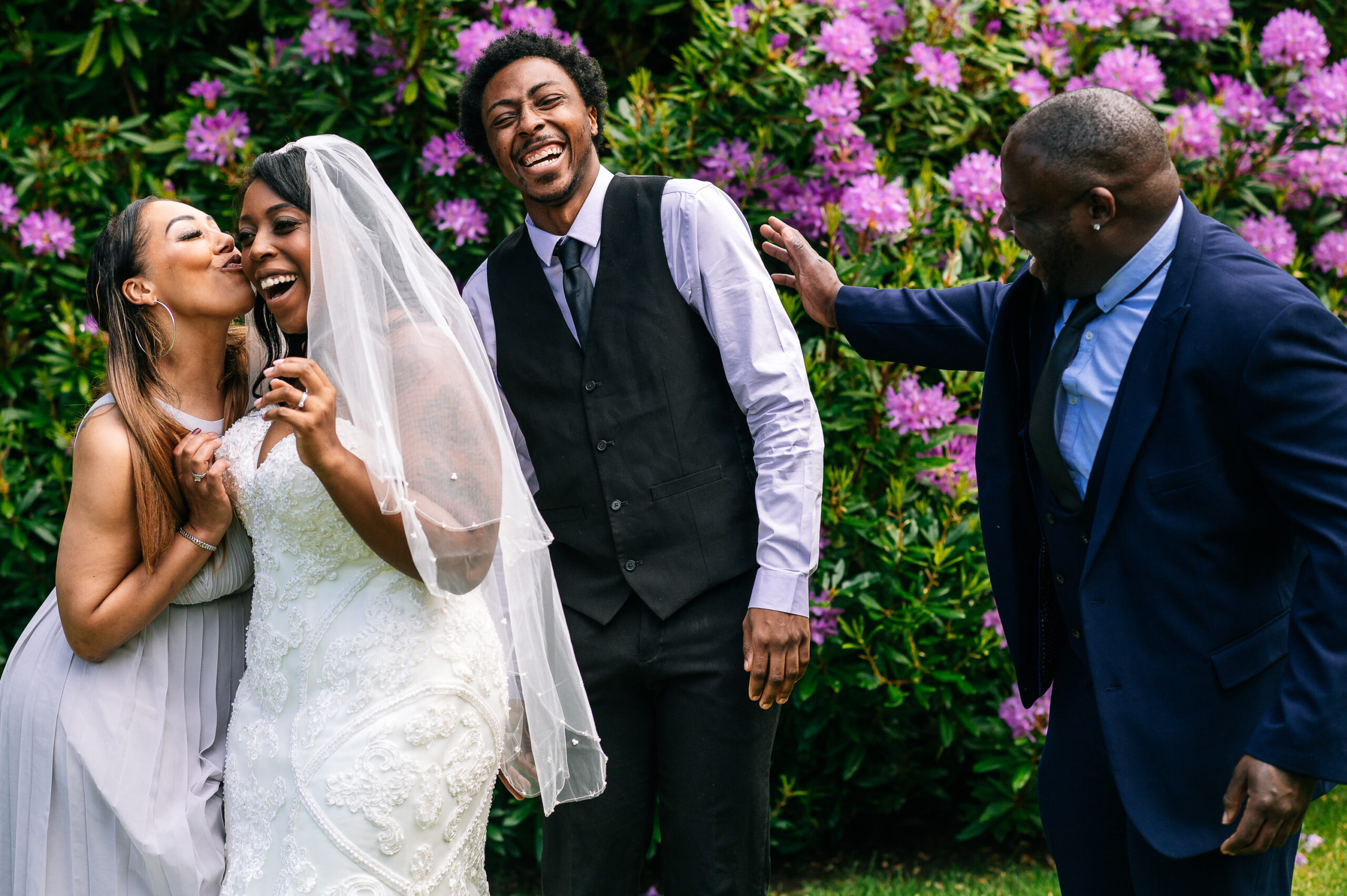bride laughing and joking with her siblings