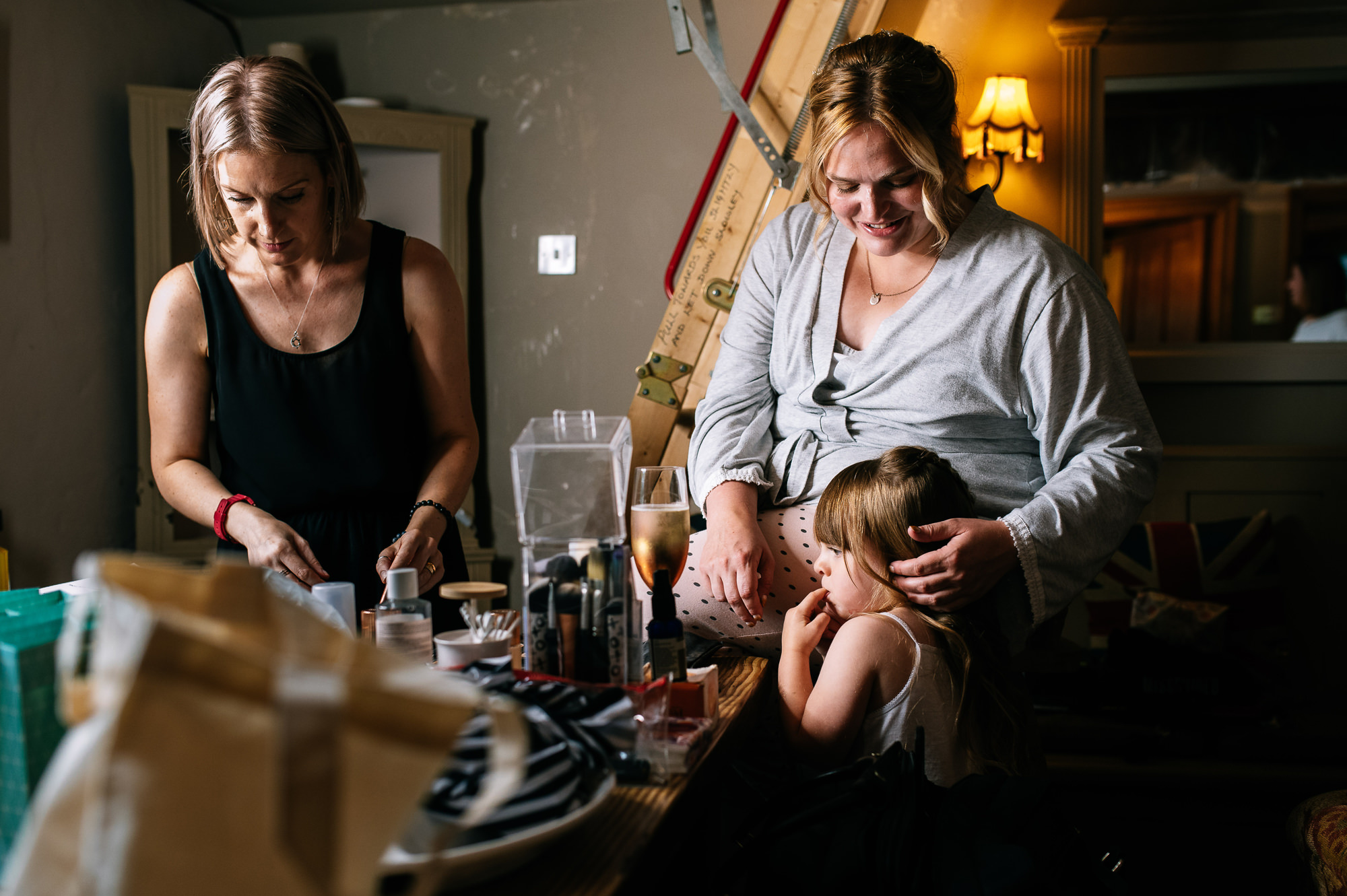 bride on her wedding morning comforting her daughter