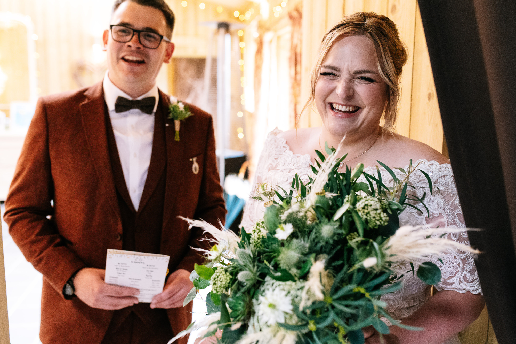 bride and groom stood together smiling