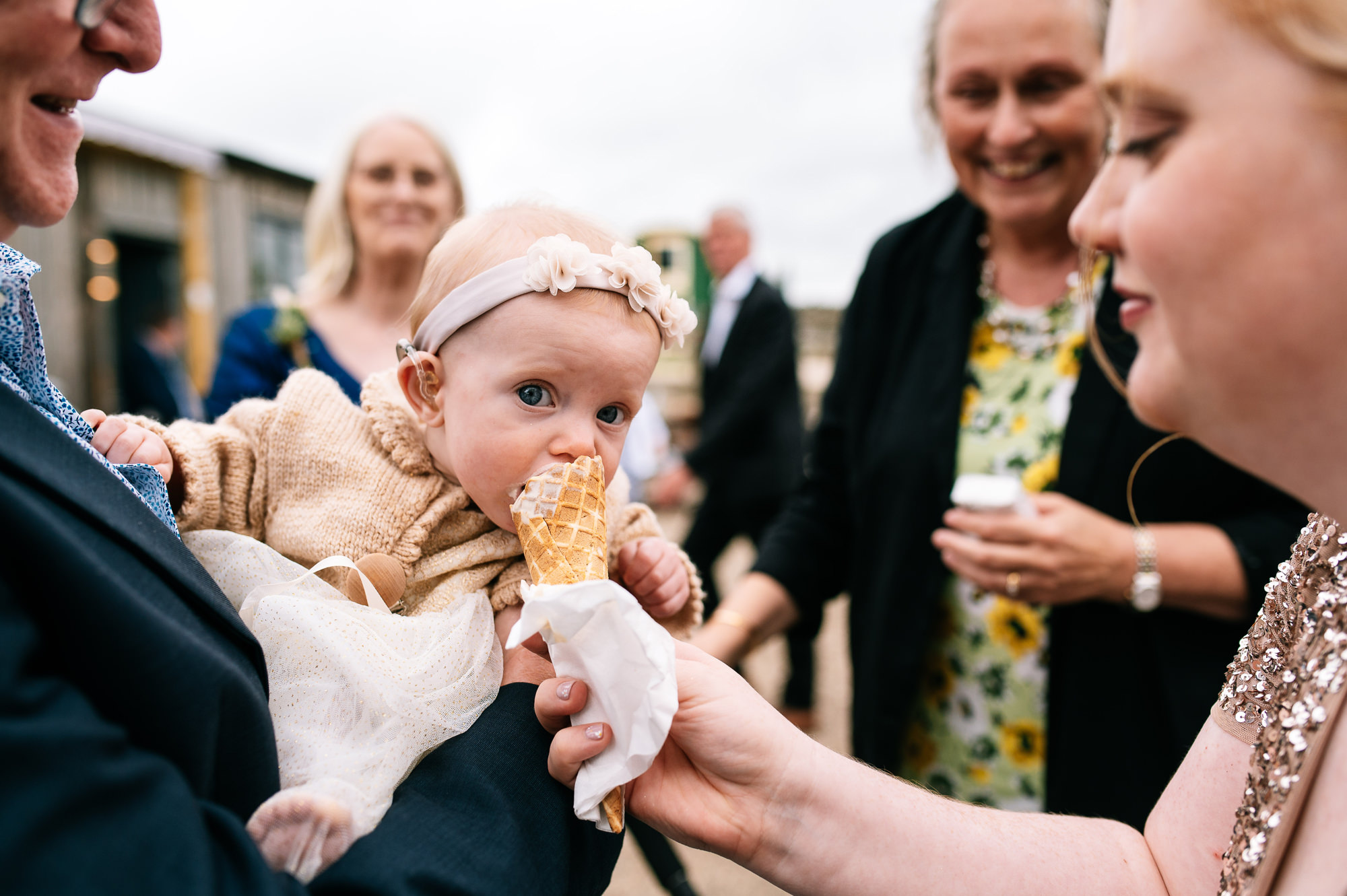 young baby enjoying an icecream cone