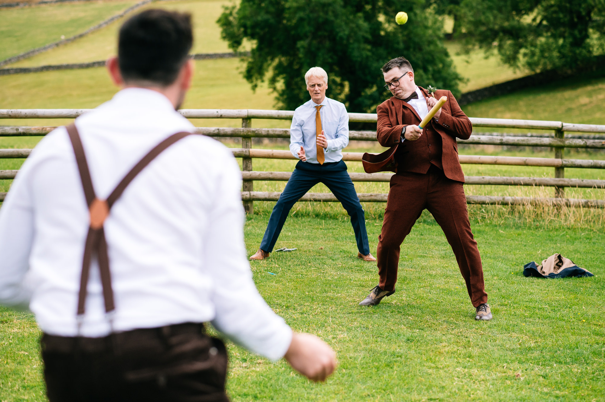 groom hitting the ball during a rounders game