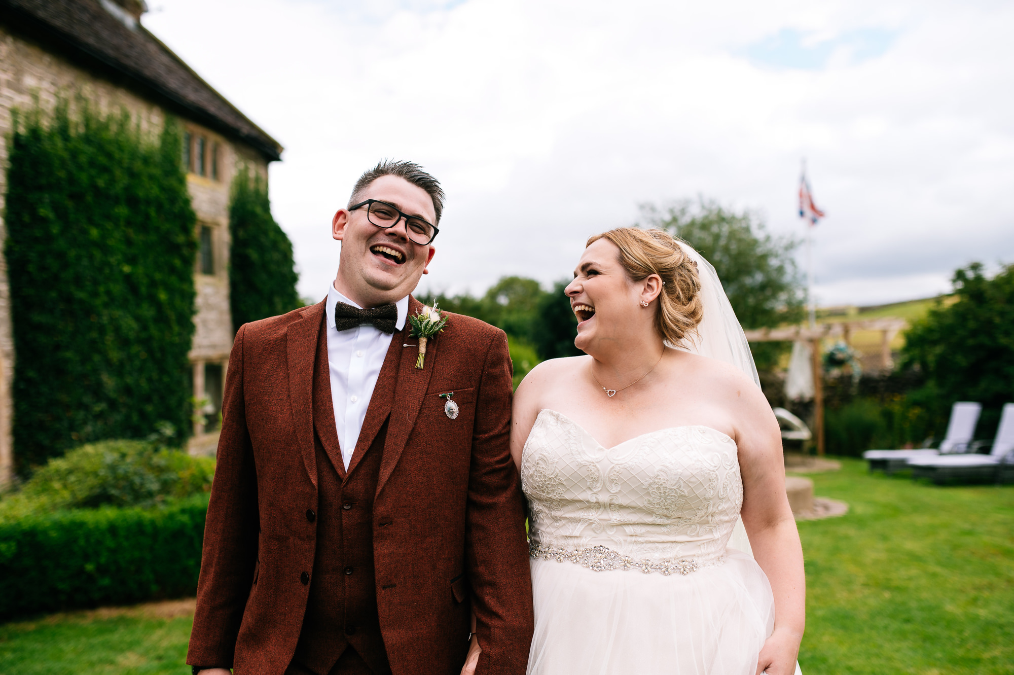 bride and groom laughing together