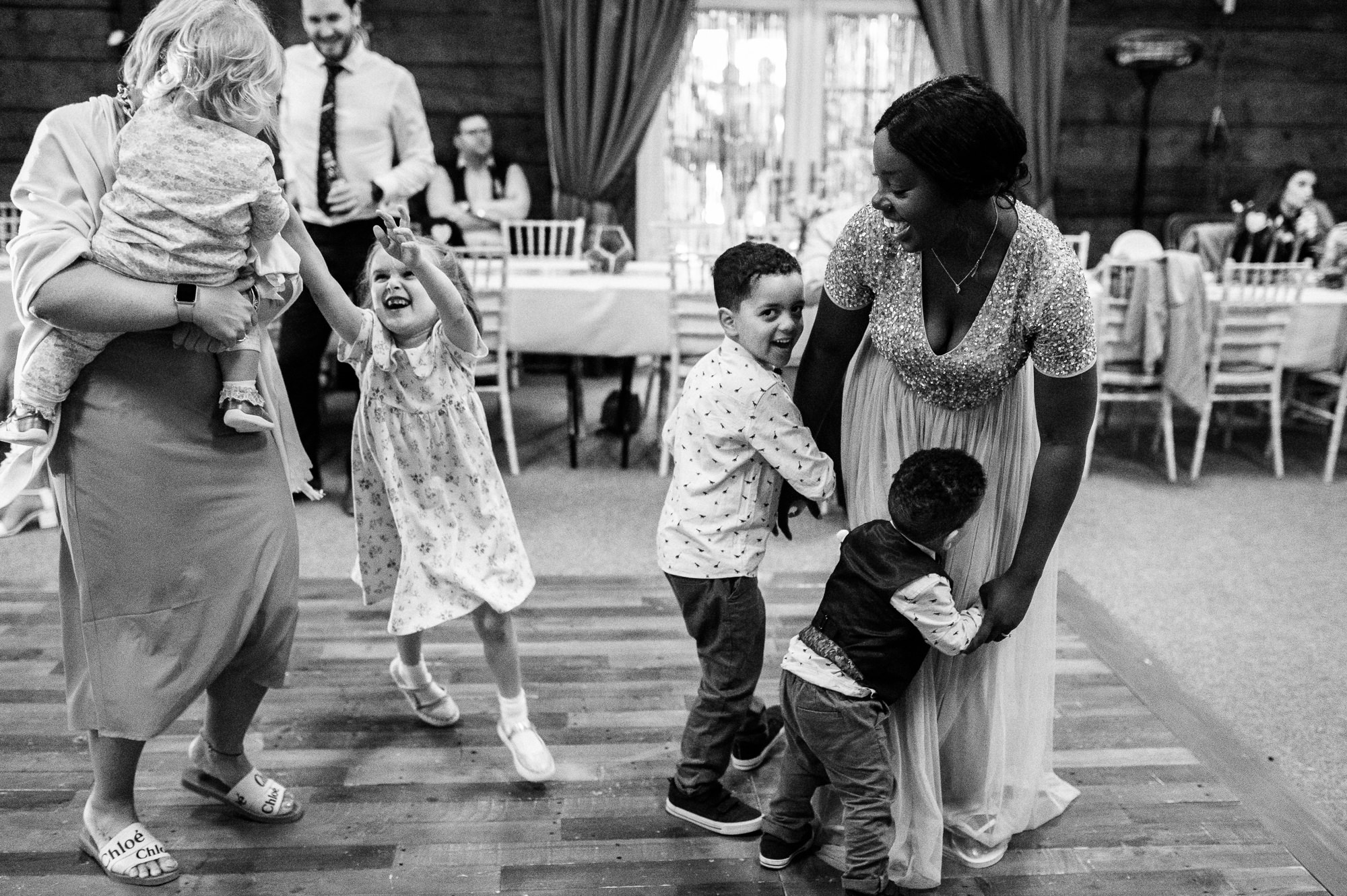 kids playing with their mums on the dancefloor