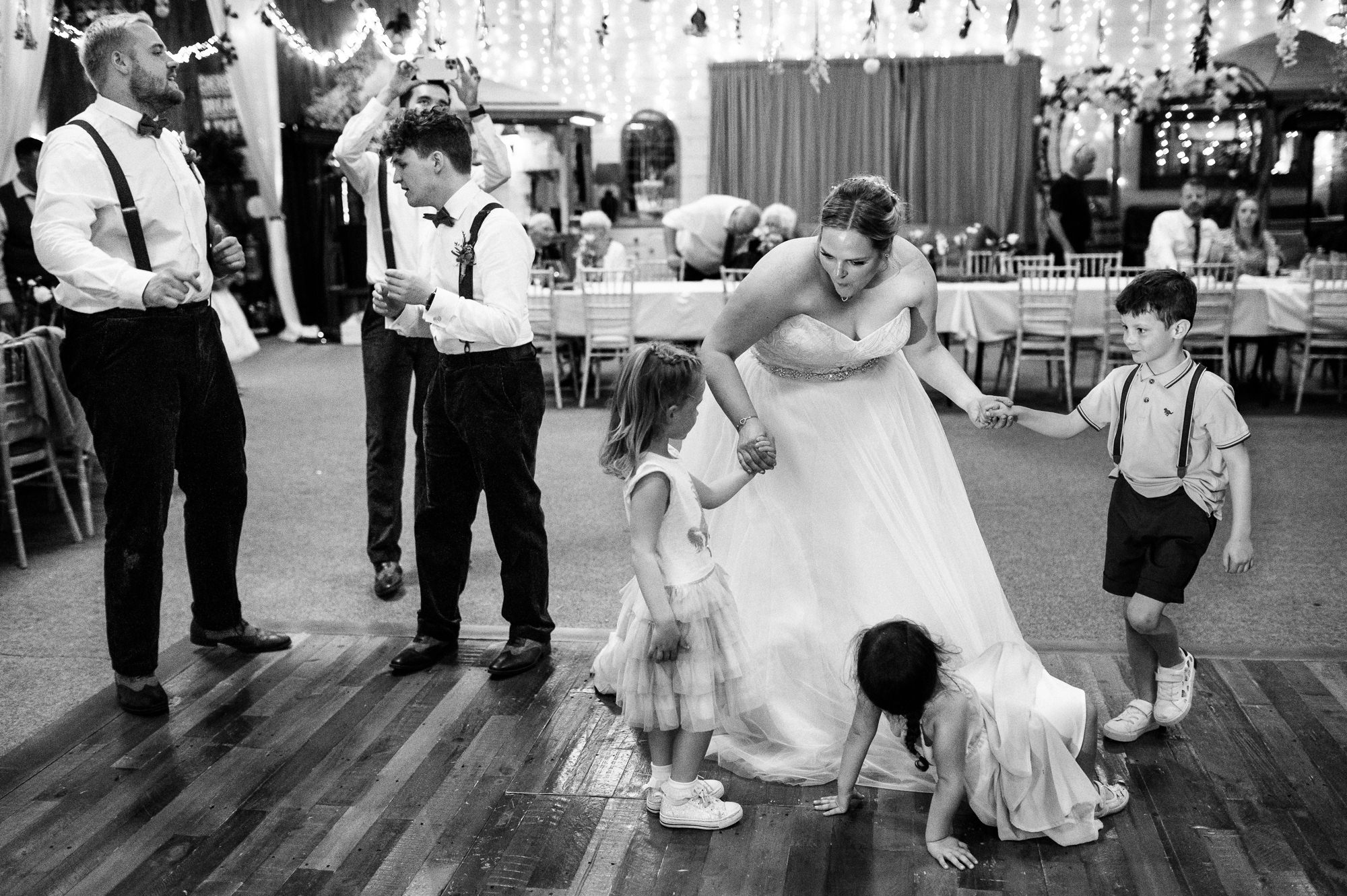 bride dancing with kids at lower damgate farm