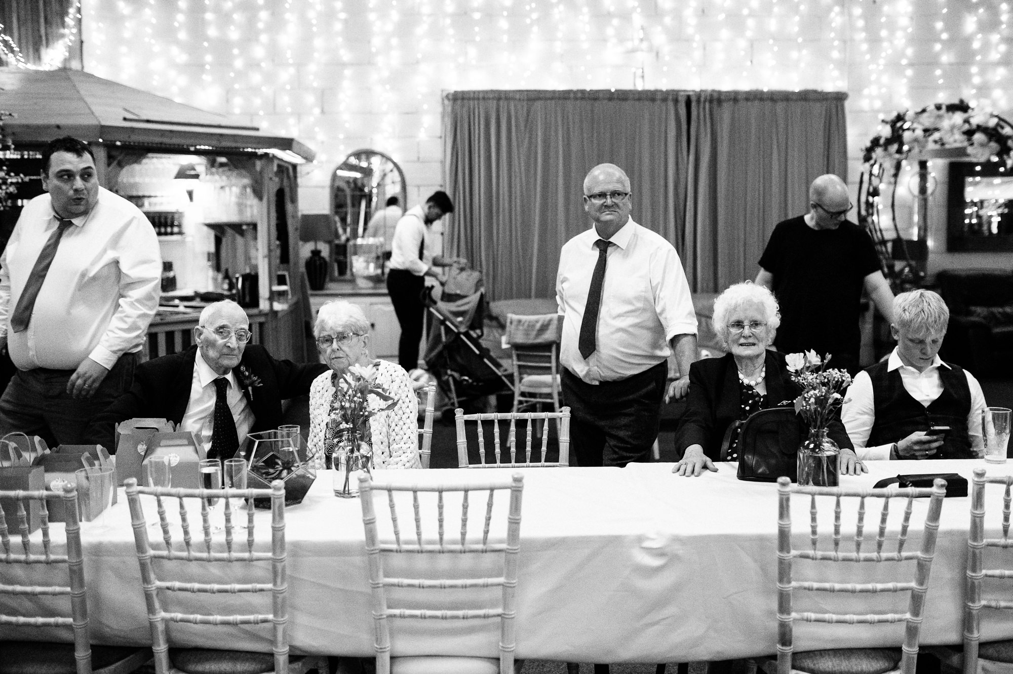 older folks sat down watching the dancefloor