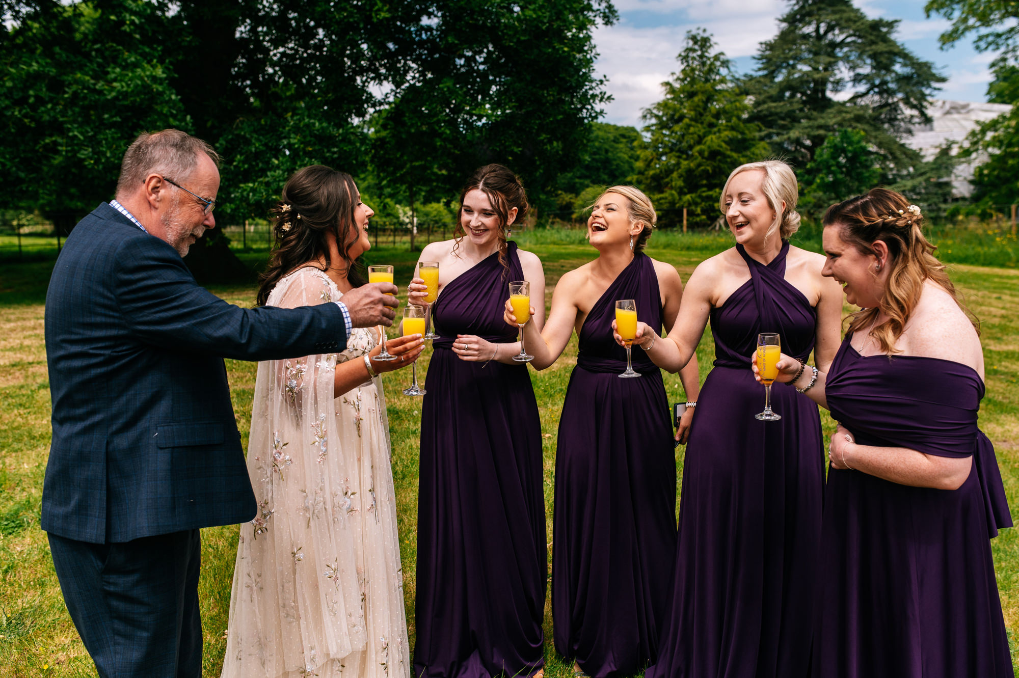 bride having a toast with her bridesmaids