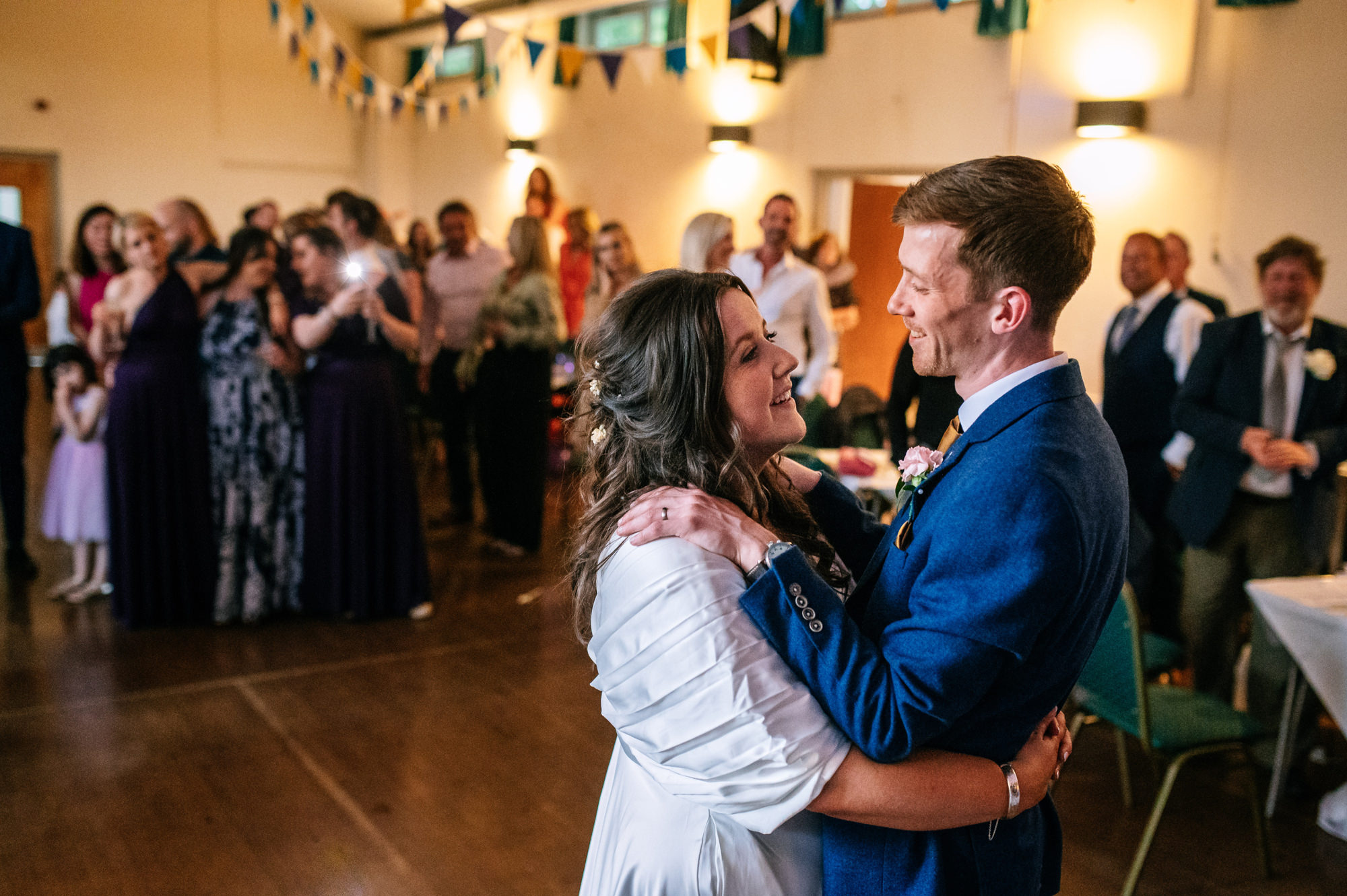 couple having their first dance in the local village hall